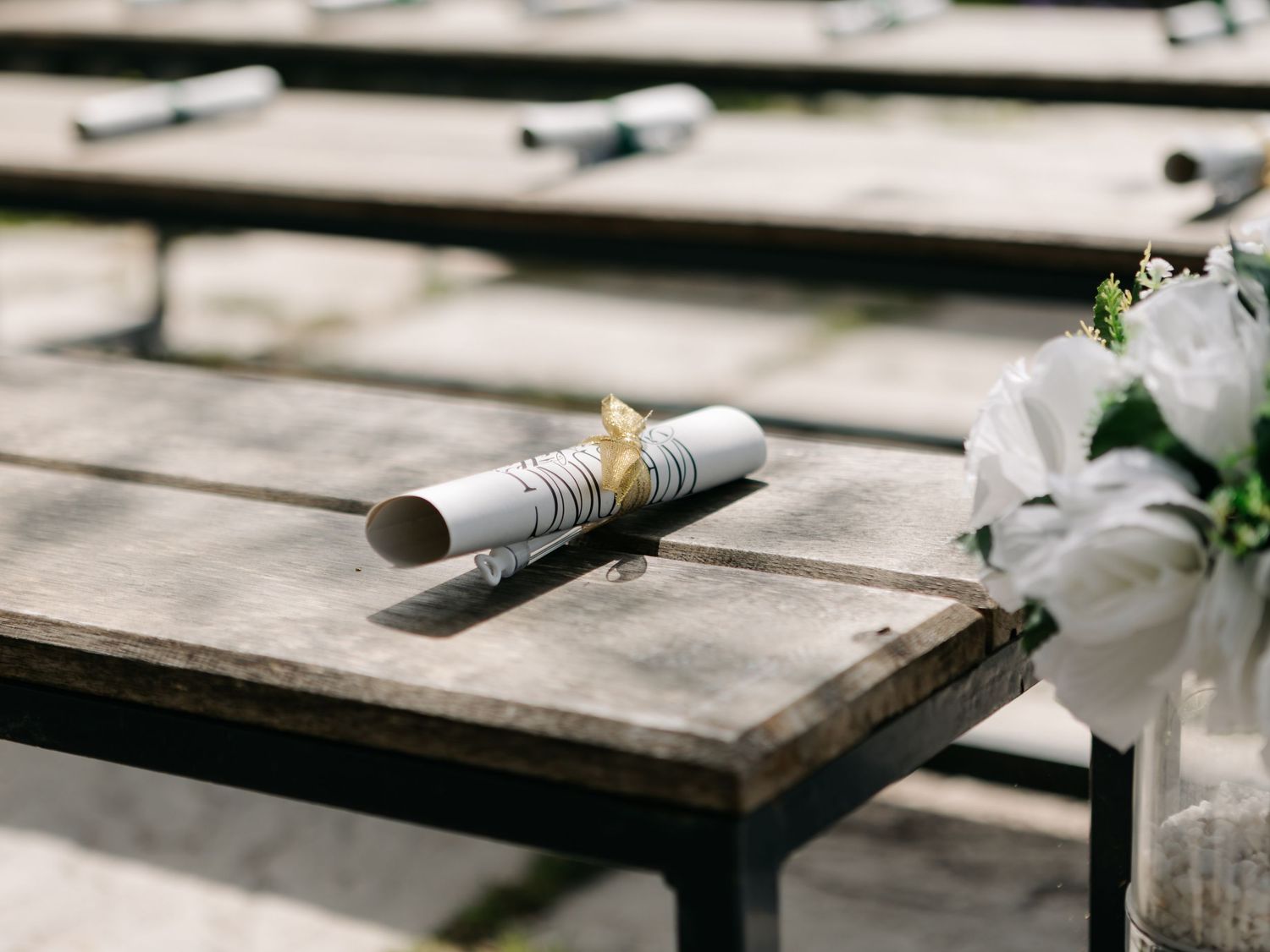 Wedding decor details and decorative elements arranged on a rustic surface.