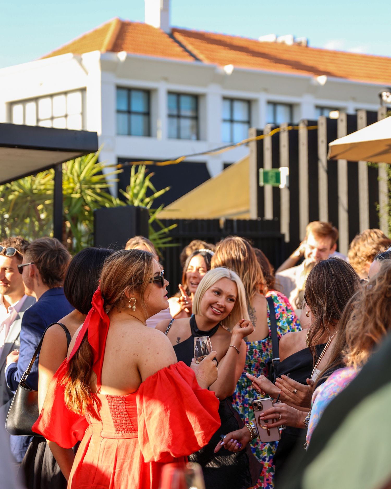Cup week celebrated at Aikmans Merivale, guests dancing in the crowd.