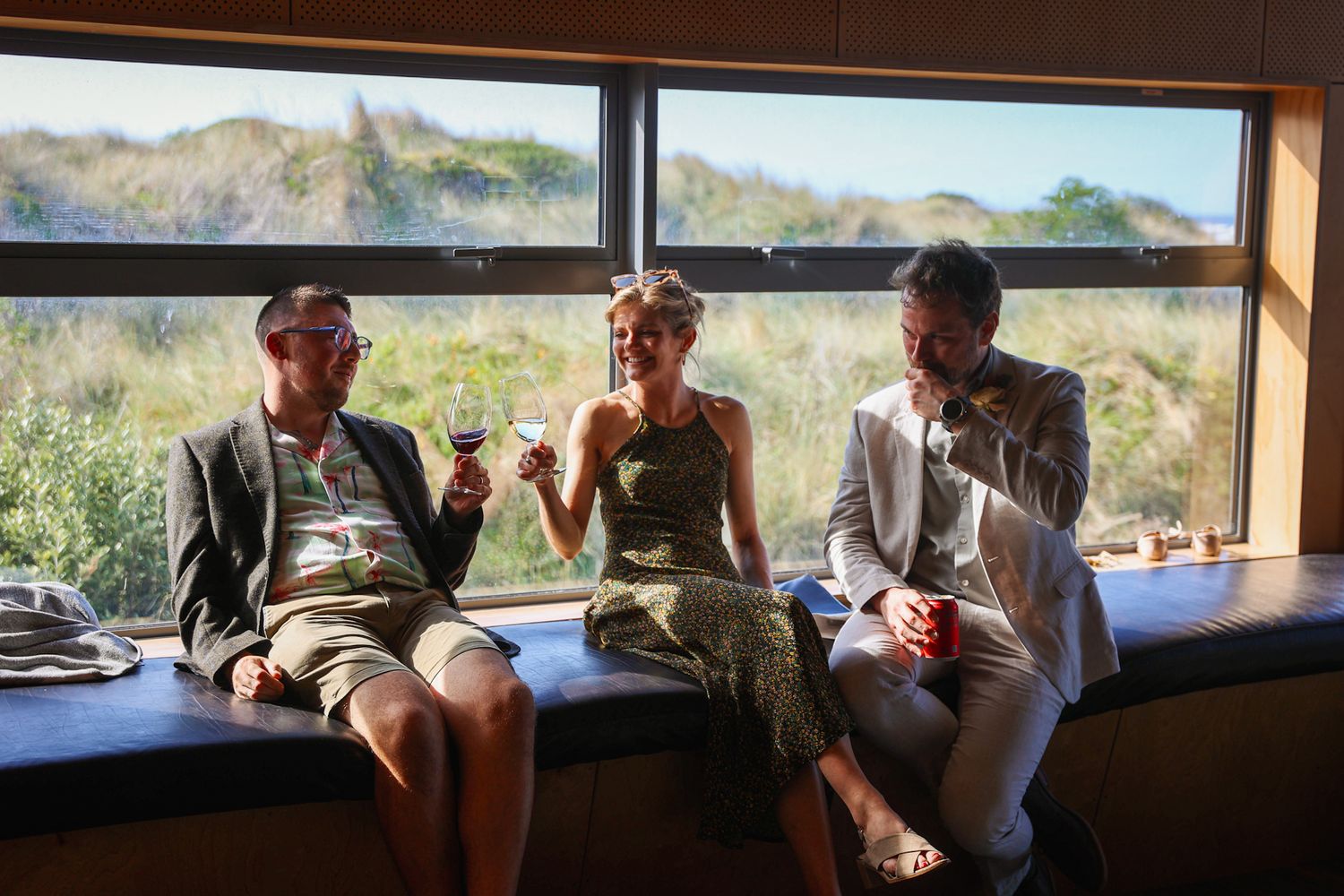 Wedding guests toasting a glass of wine