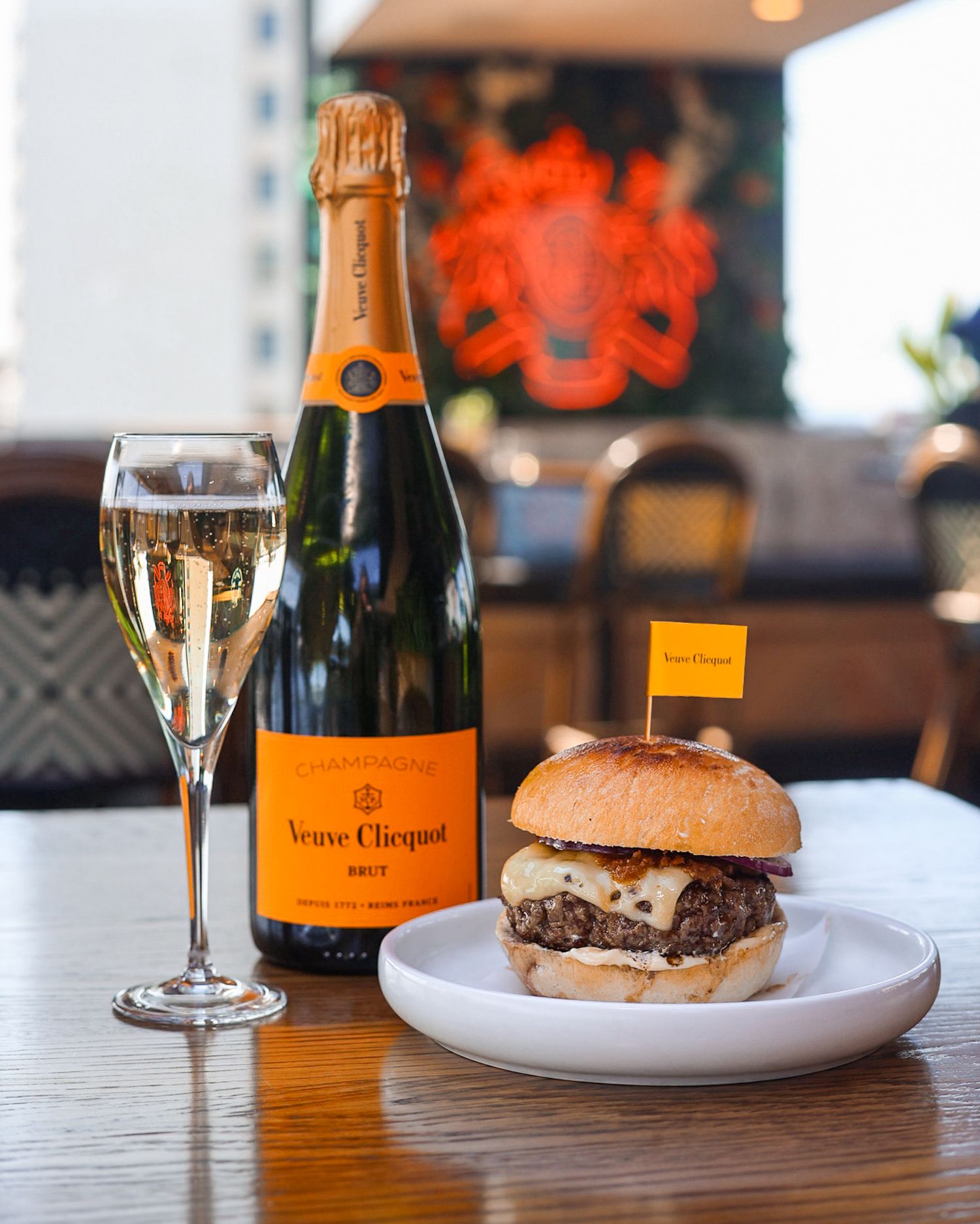 Veuve Clicquot bottle with a Burger at Mr. Brightside Rooftop Bar