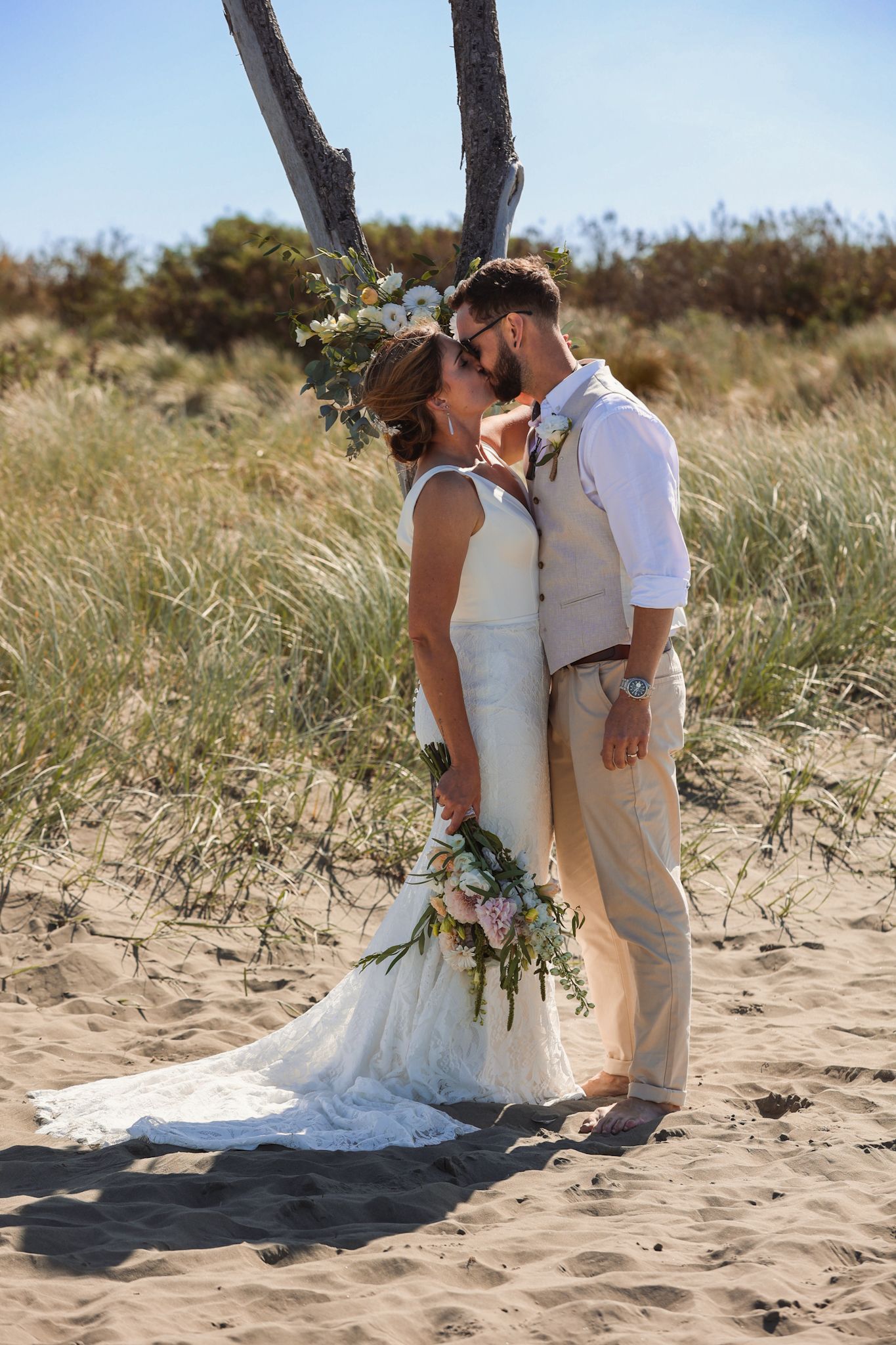 Bride and groom at Southshore New Brighton Beach during their newlywed portraits
