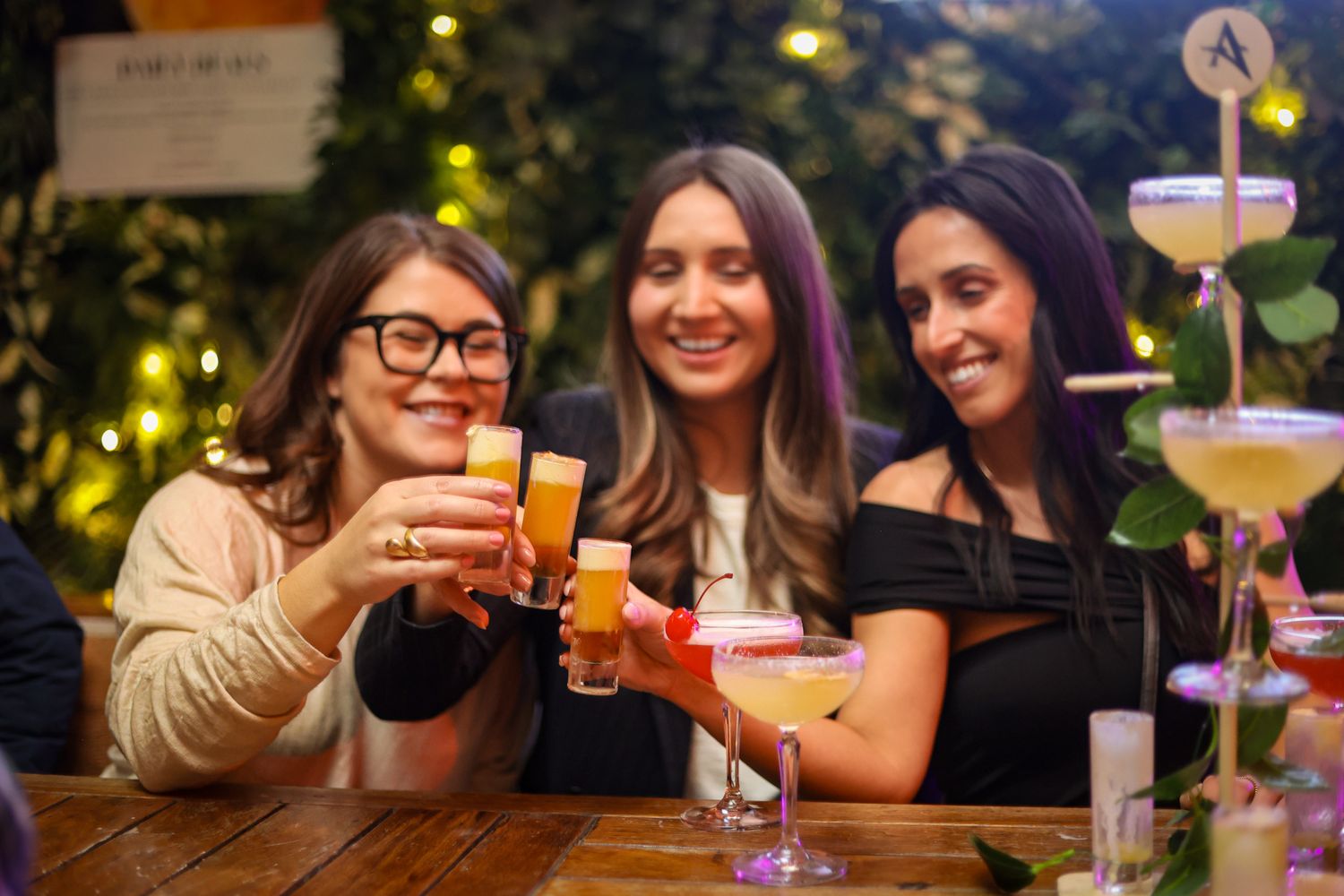 Girls cheersing a round of shots