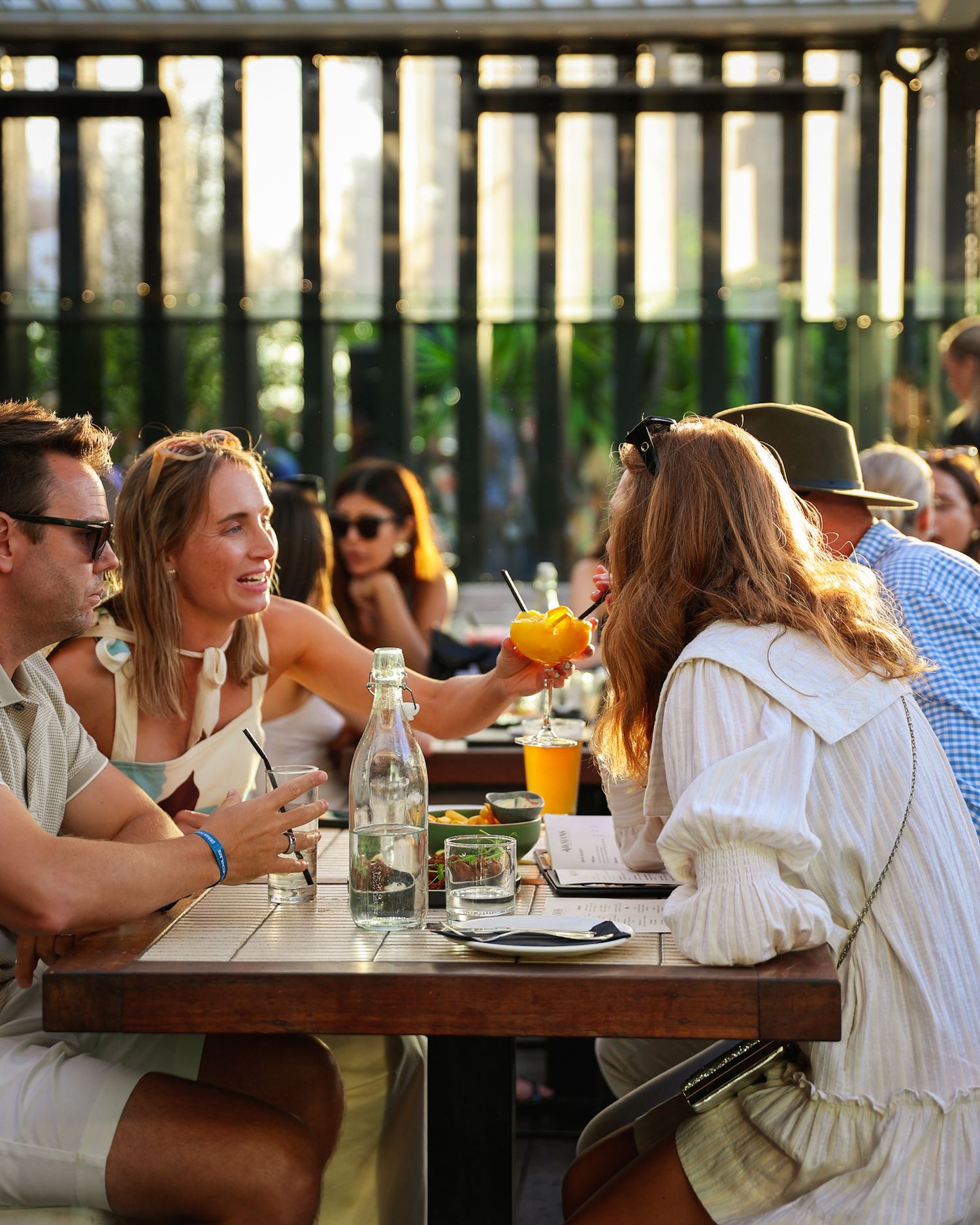 Group of people drinking frozen slushy cocktails at Aikmans Merivale