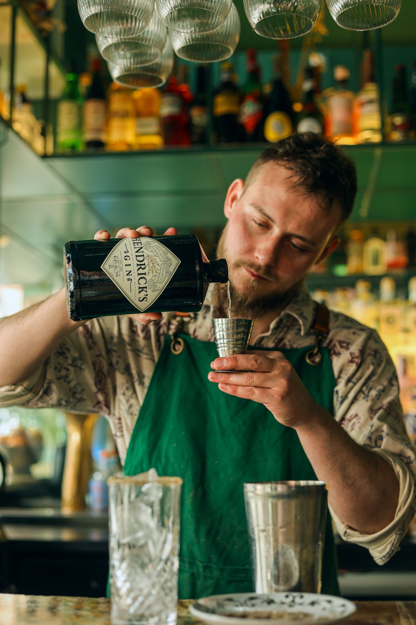 A bartender pouring out a shot of Hendricks gin at Gin Gin bar in Christchurch.