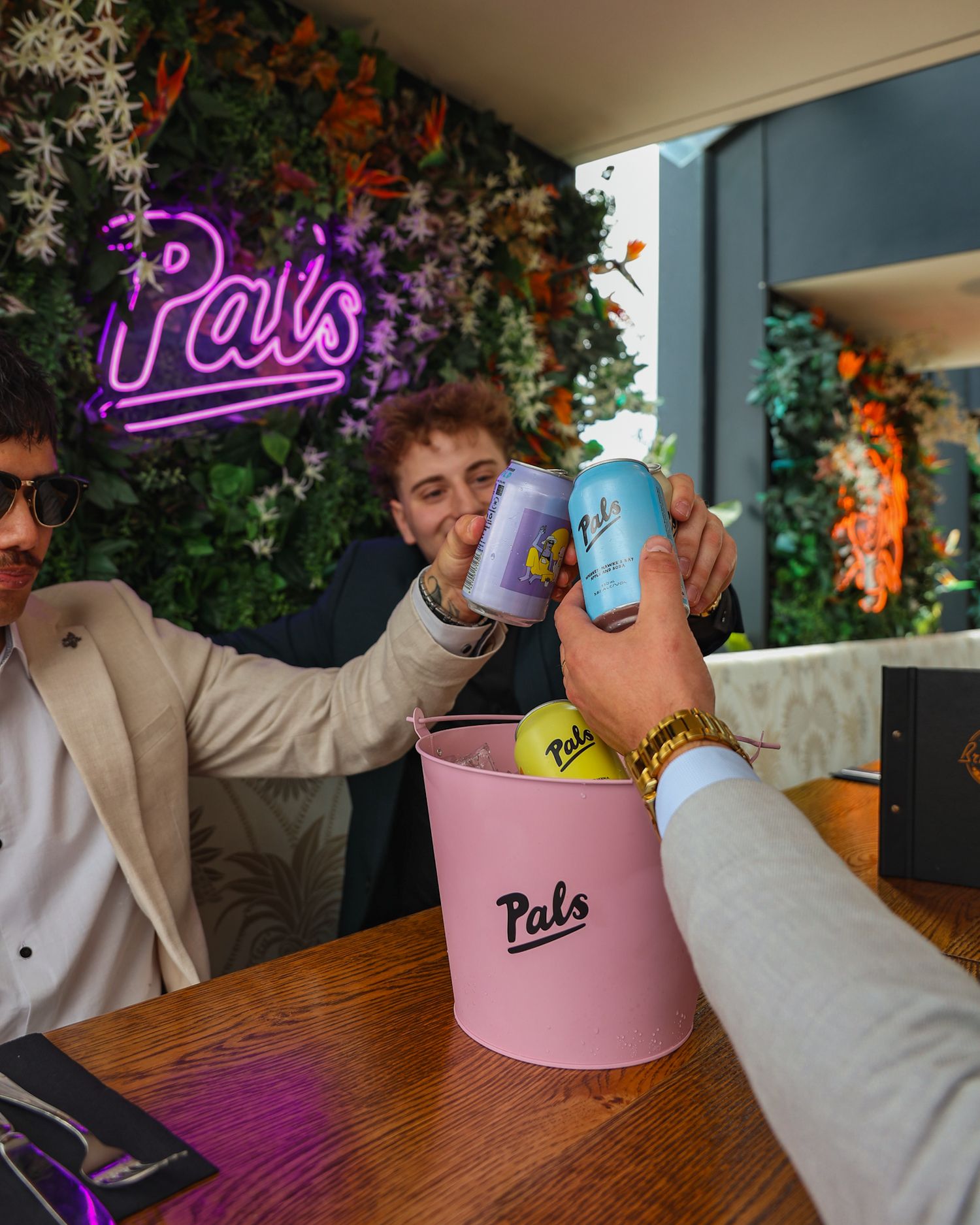 Cheersing a selection of Pals alcoholic soda cans