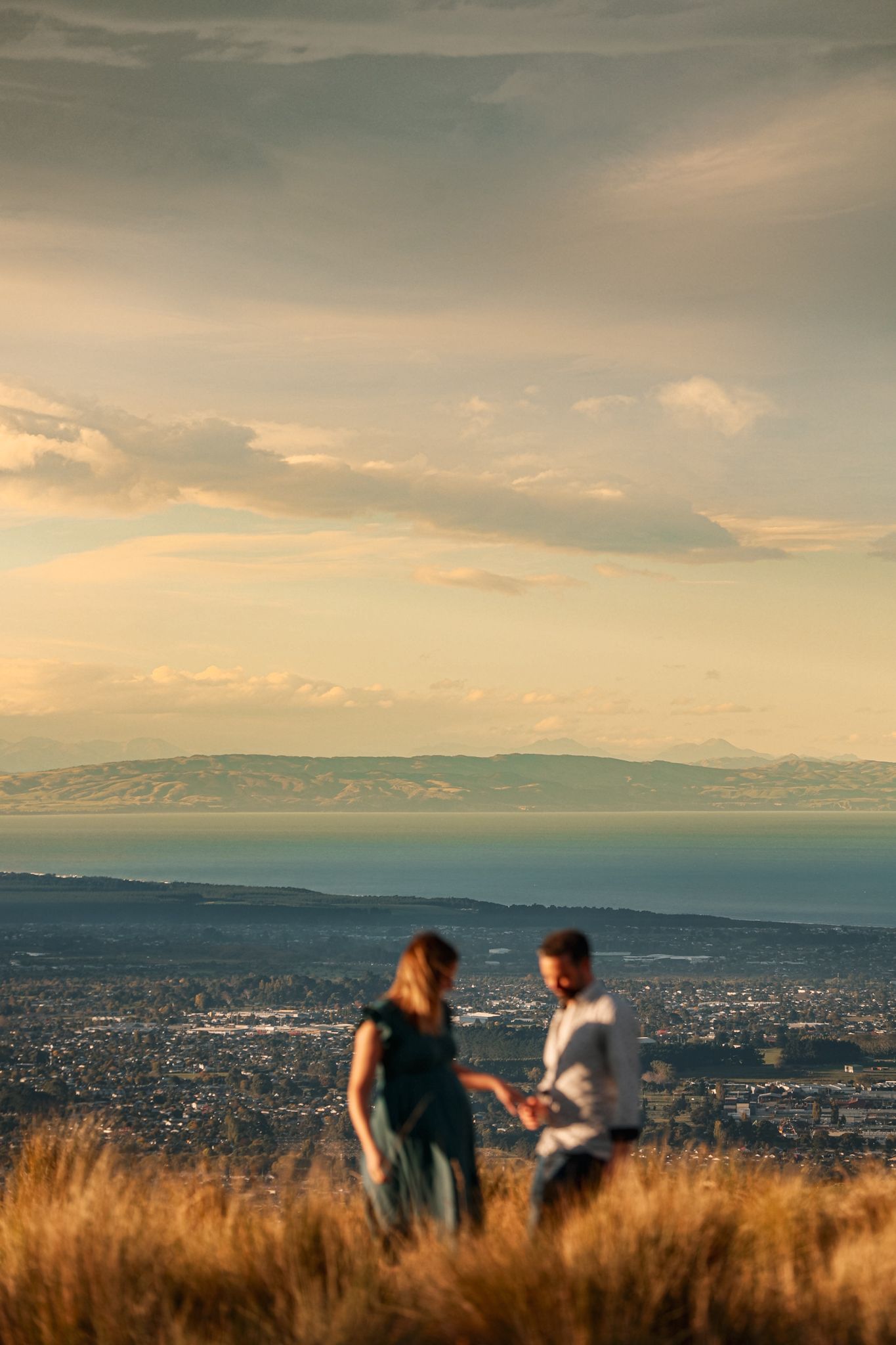 Golden hour maternity and family portrait session in the Christchurch Port Hills with views of the Canterbury Plains