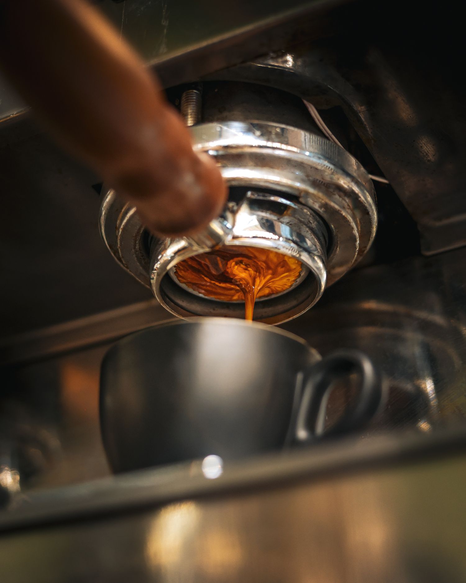 Espresso shot extraction into a coffee cup