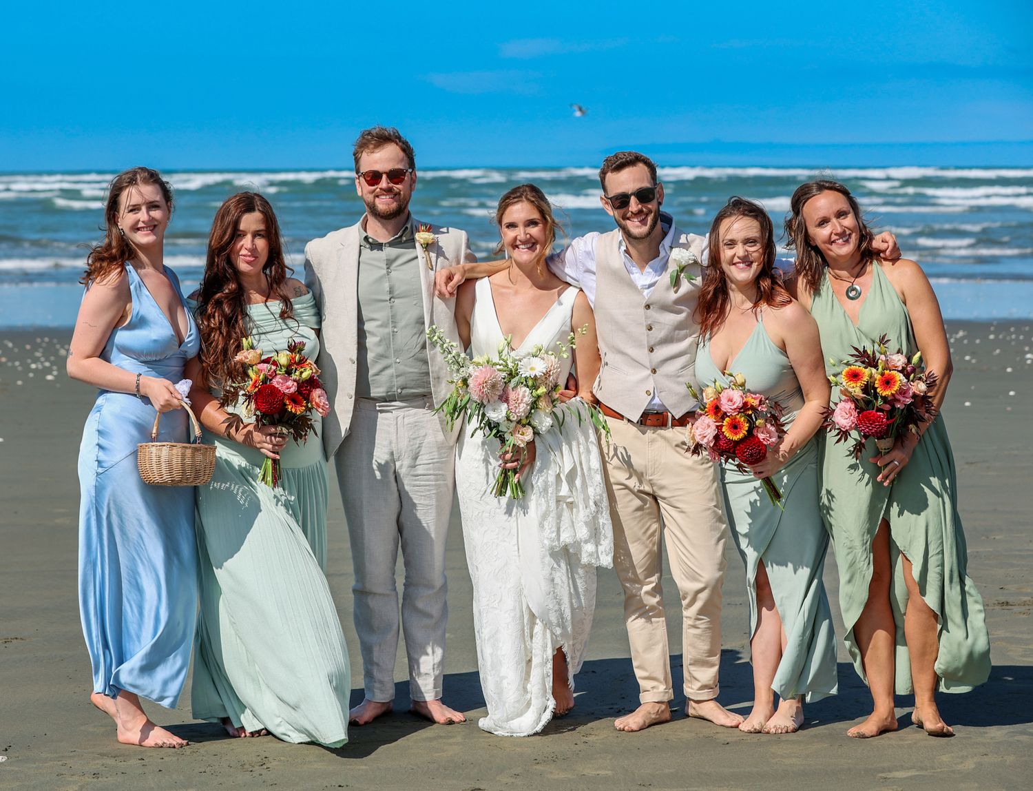 Bride, groom and bridal party posing for a group photo