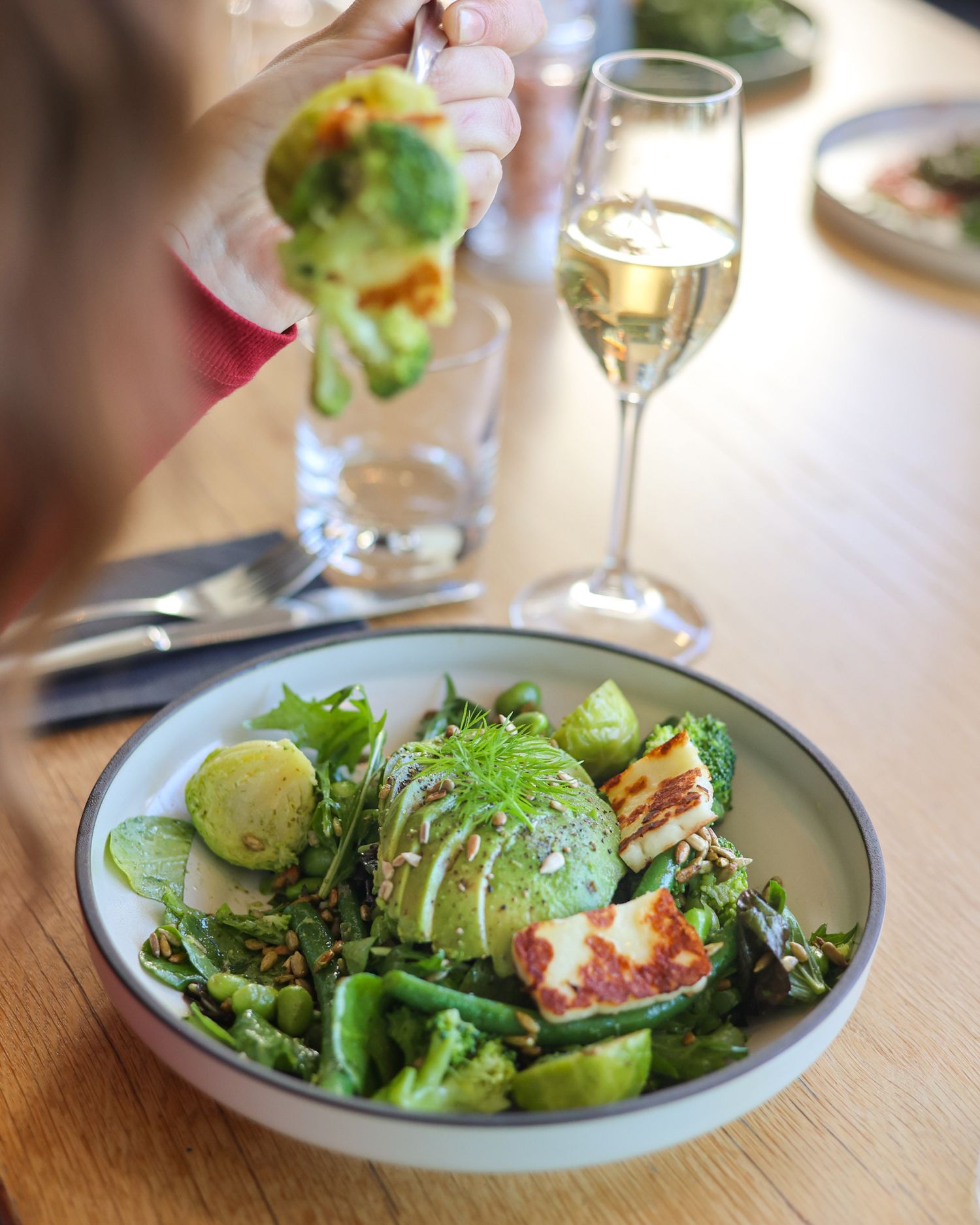Avocado salad at Aikmans Merivale with a glass of Champagne
