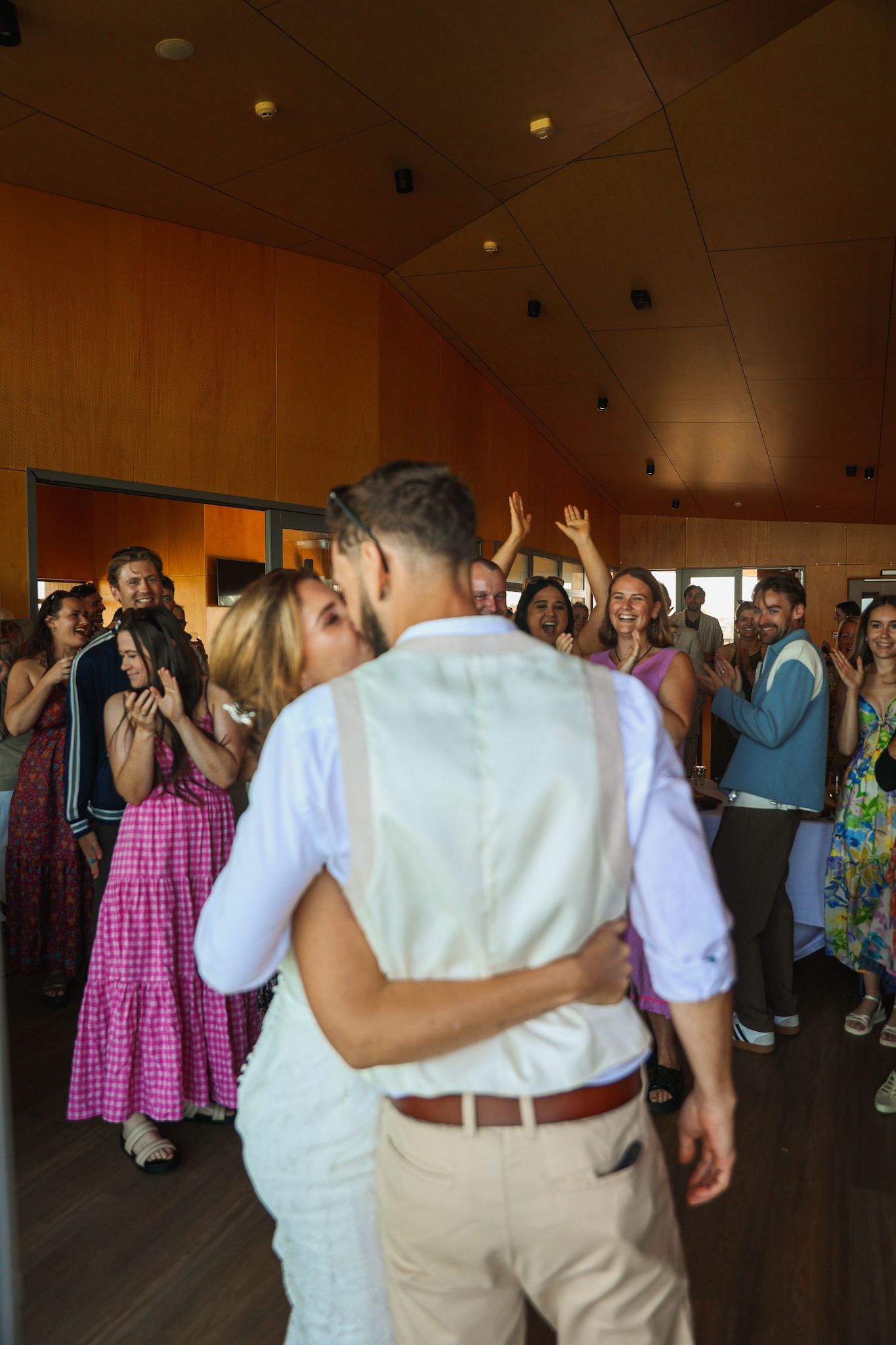 Bride and groom arrive at their reception party