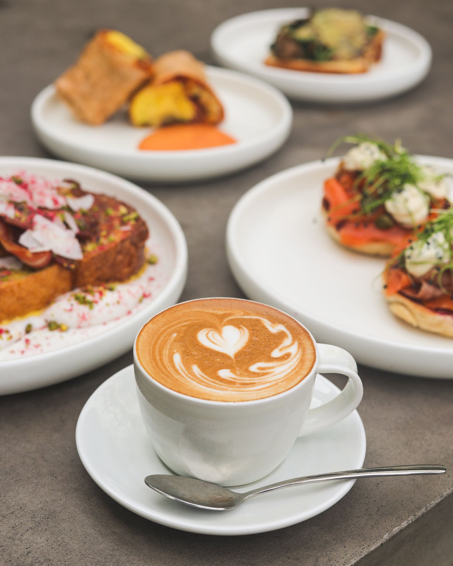 Breakfast spread with a latte coffee at Brigittes Merivale