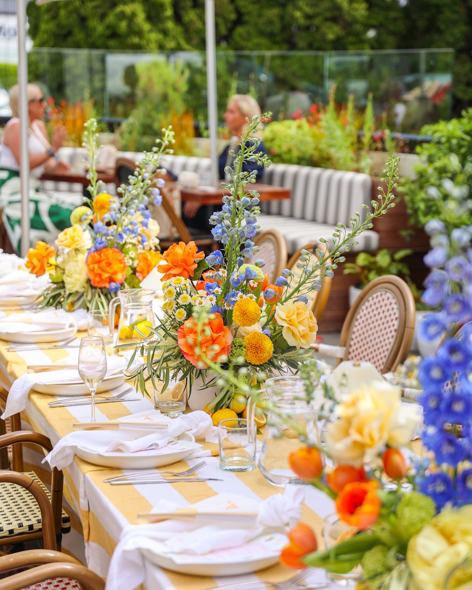 A bright summer party at Brigittes Merivale in Christchurch. Bespoke flower arrangements on a long table for a long private lunch event.