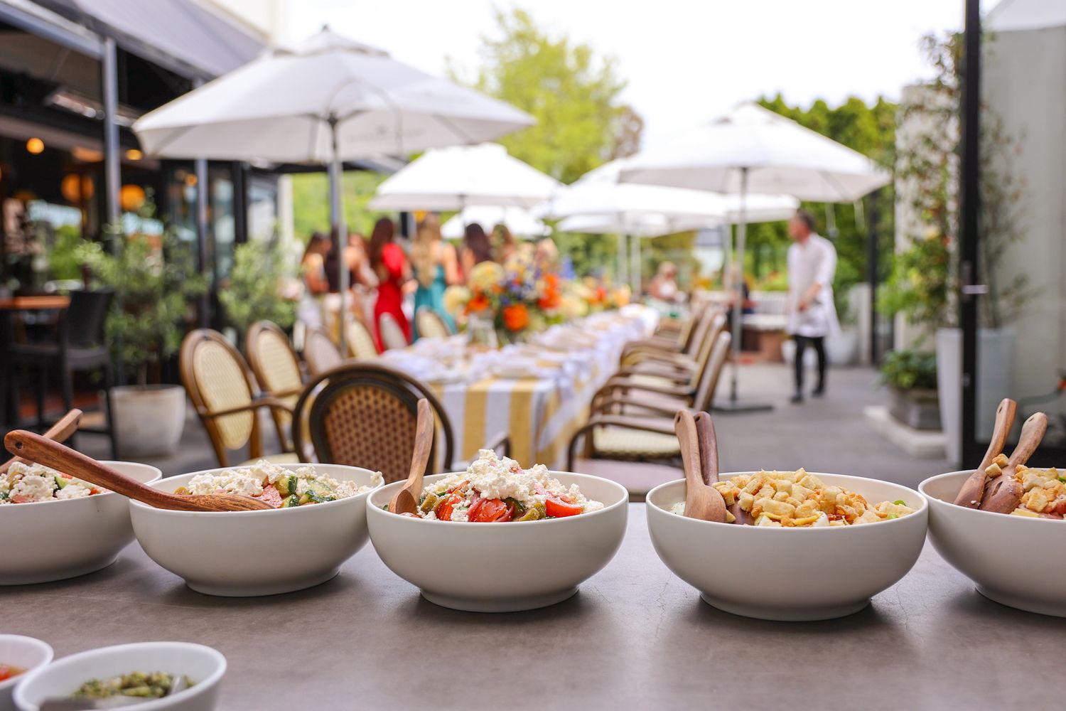 A buffet table spread at a birthday summer garden party in the courtyard at Brigitte’s Merivale
