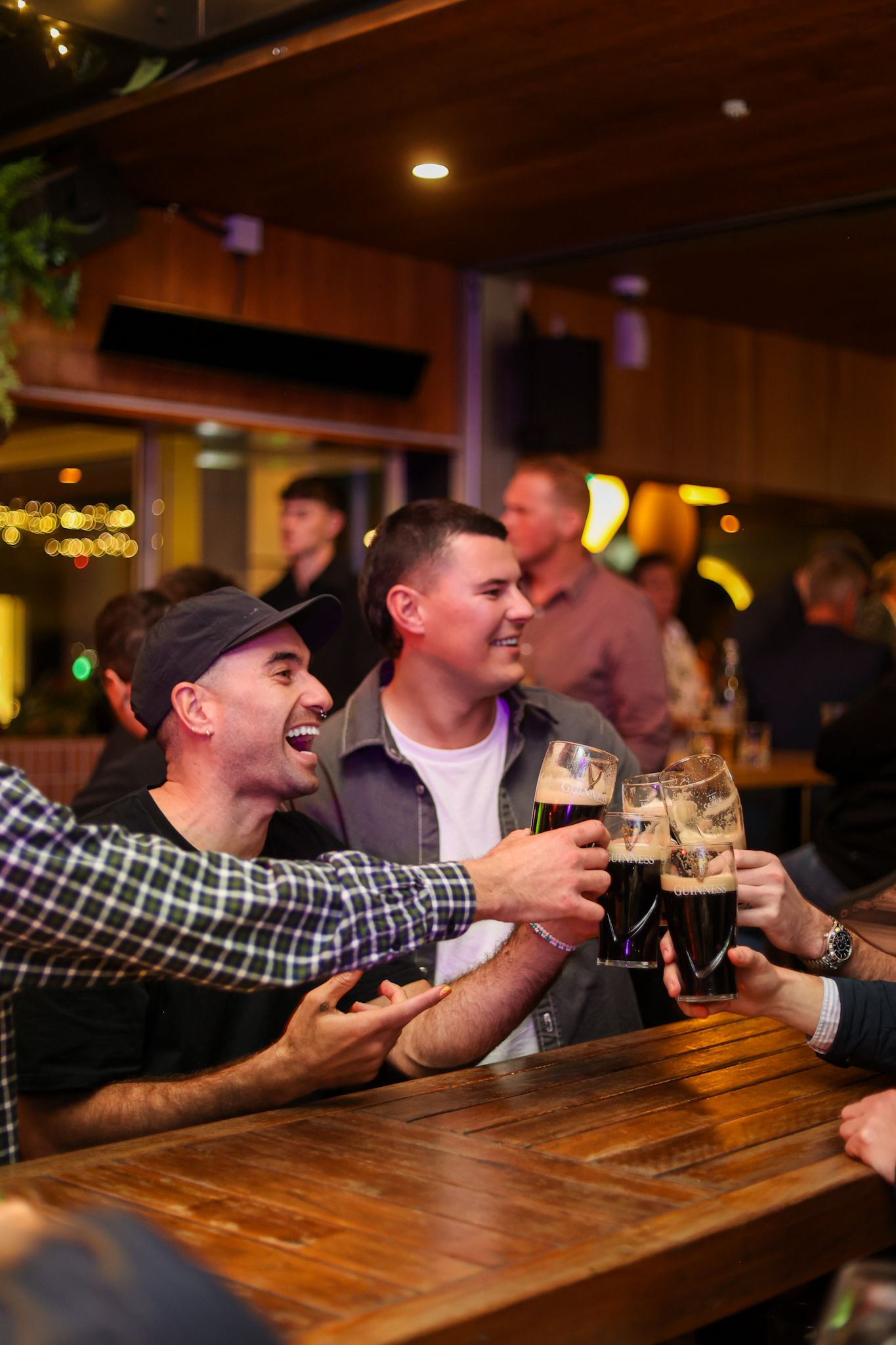 Boys launching holding a pint of Guinness