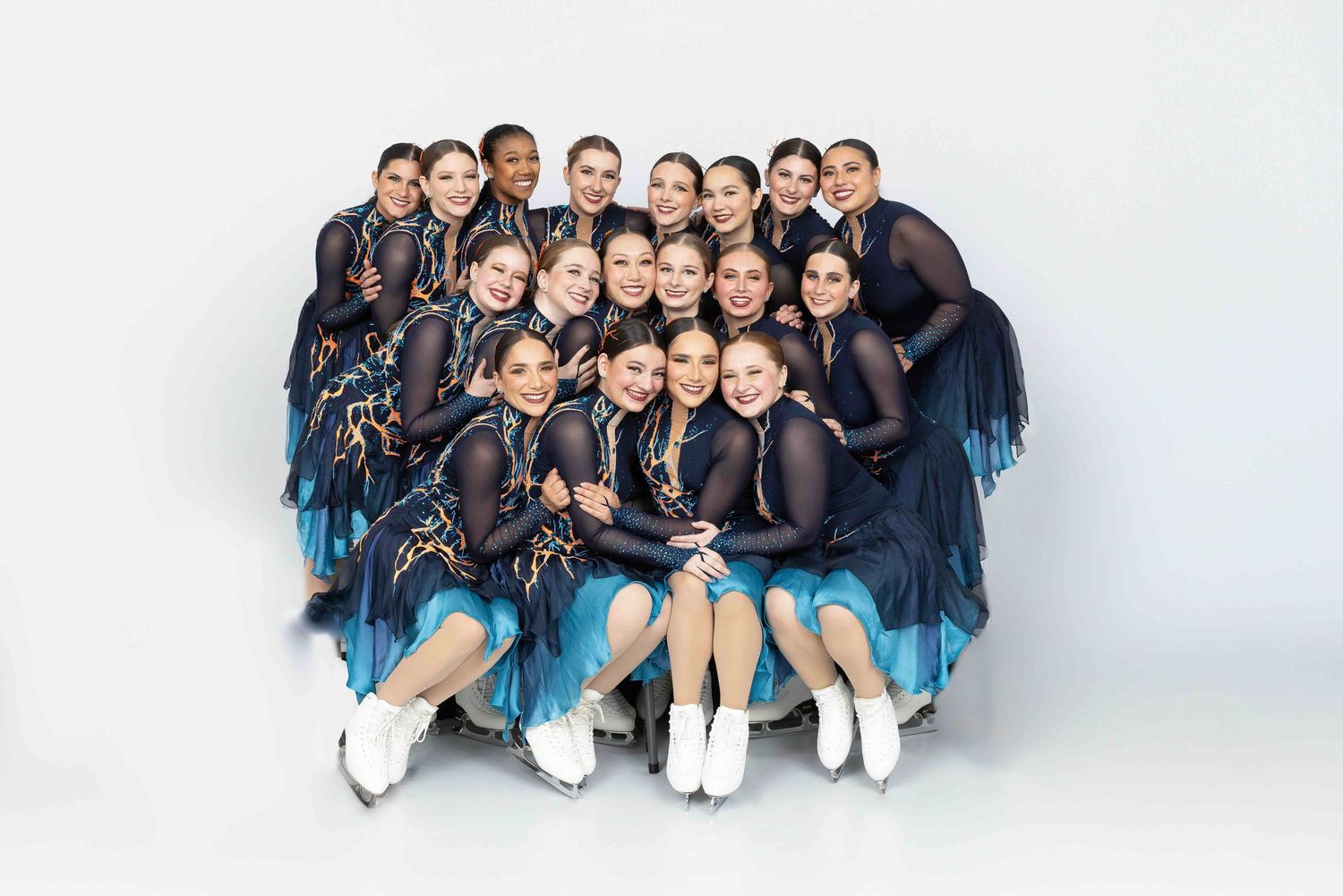 Haydenttes national synchronized team shot one white seamless with the team in their performance costumes.