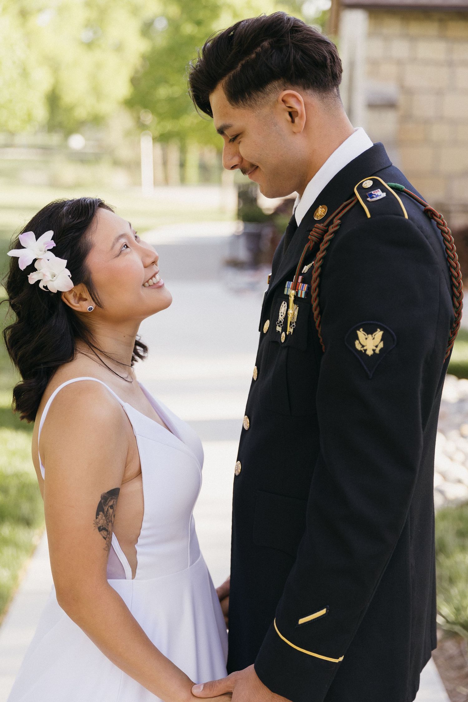 A sweet candid moment between a bride and groom on their wedding day.