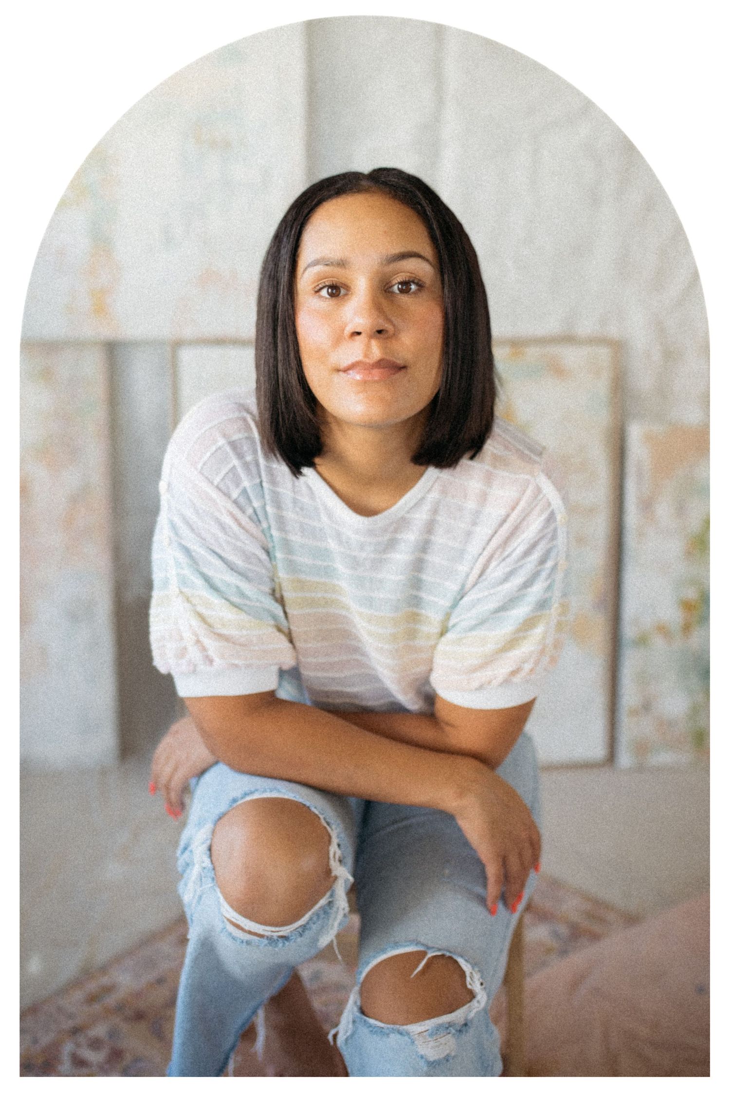 Indoor portrait showing casual summer style against a minimalist backdrop.