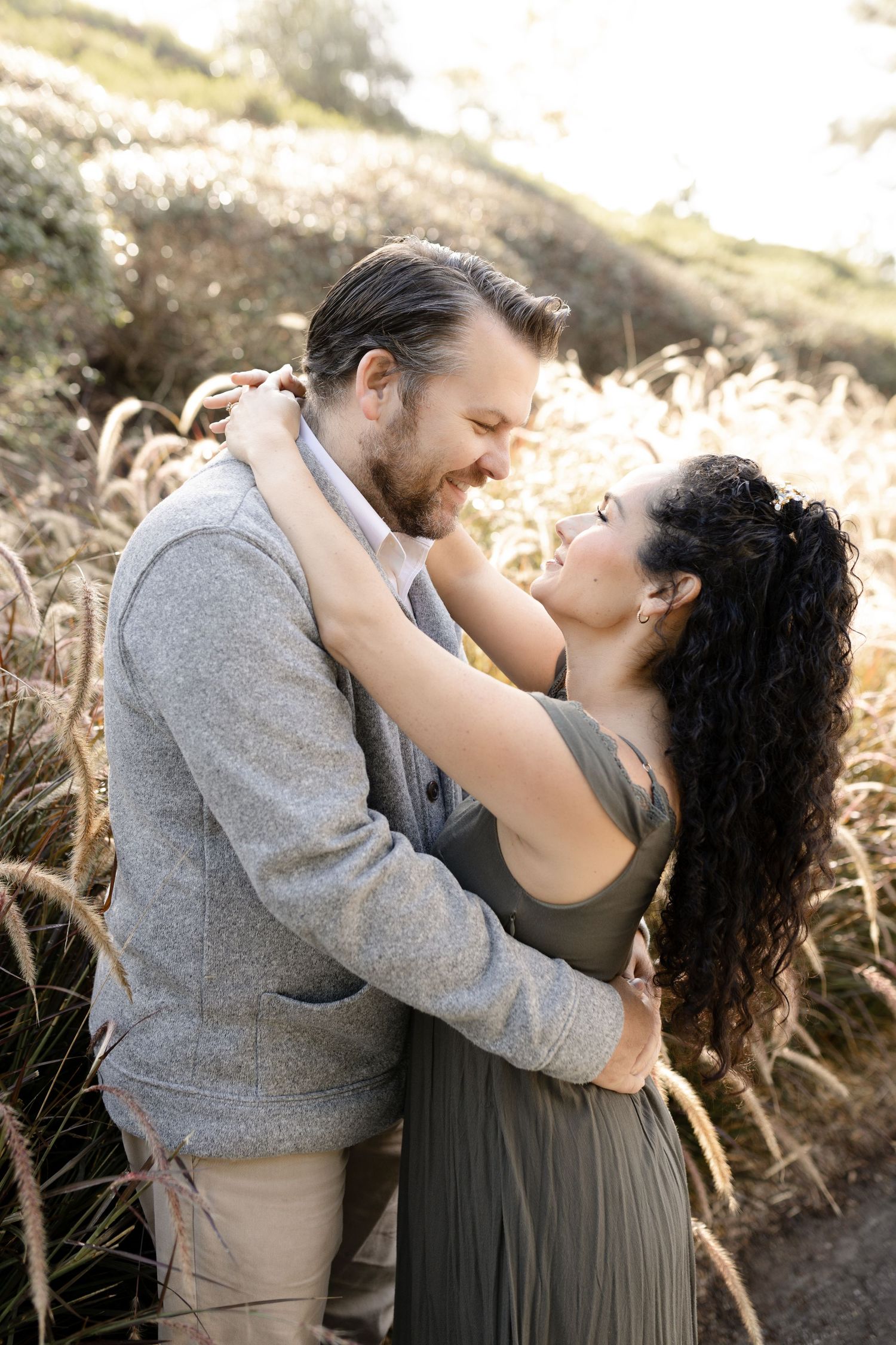 A lovely couple poses together during their family photography session in Mission Viejo, capturing a romantic and joyful moment.