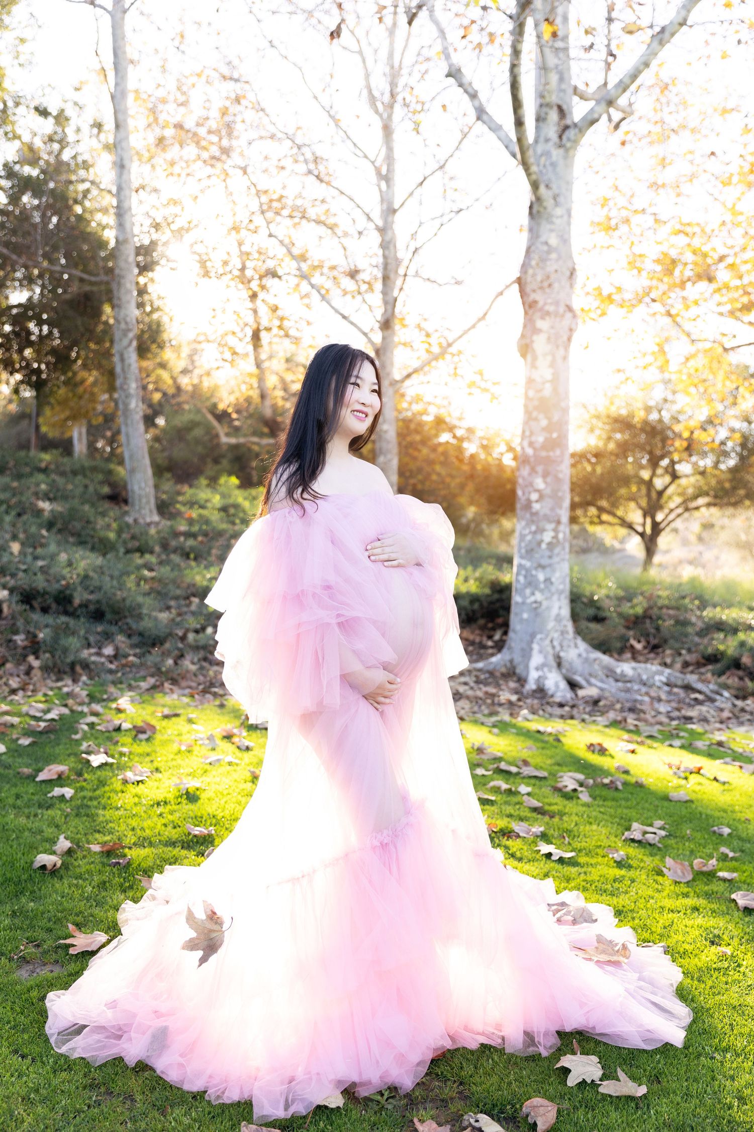 A stunning outdoor maternity photoshoot in Irvine, featuring natural scenery and soft lighting, capturing the beauty of pregnancy.