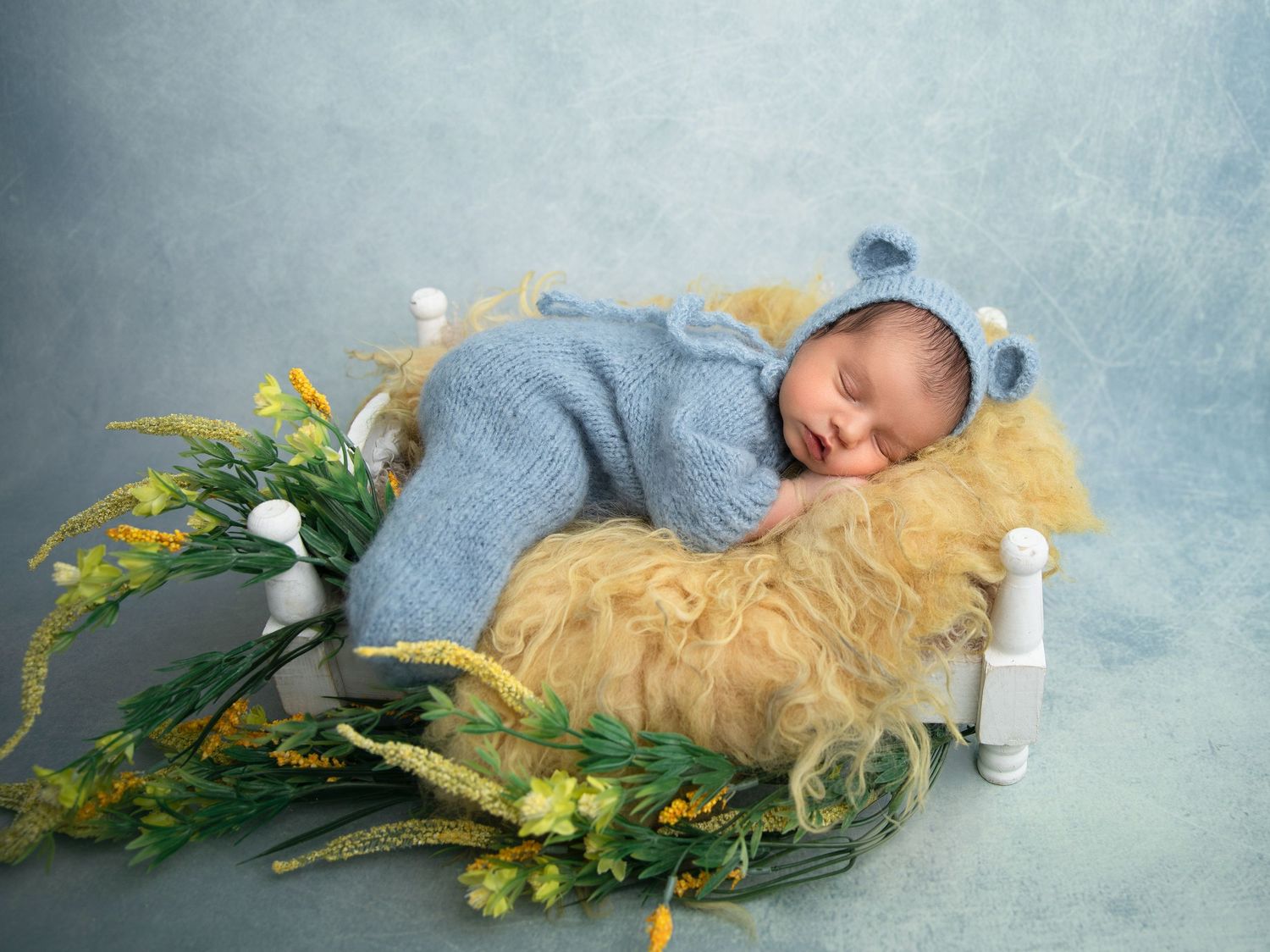 A serene in-home newborn photography session in Orange County, CA, showcasing a newborn's precious details in a cozy setting.