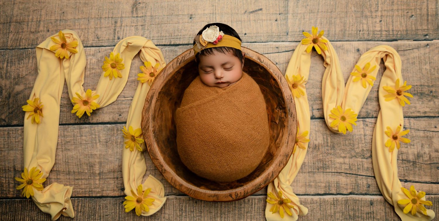 A peaceful in-home newborn photography session in Irvine, CA, capturing the intimate moments of a newborn in a cozy setting.