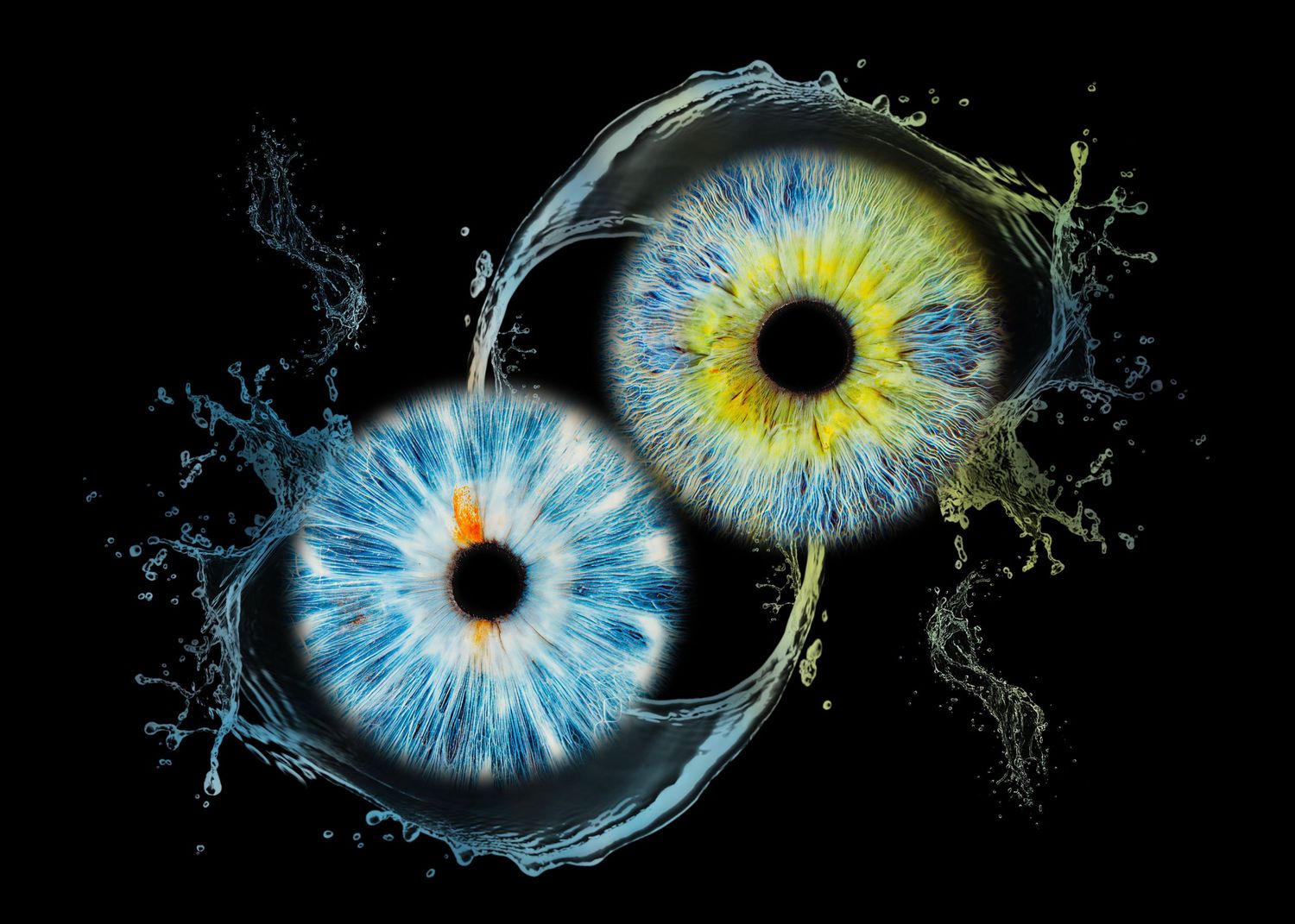 Two vibrant eyes with blue and yellow irises forming a yin-yang symbol with water splashes on black background.