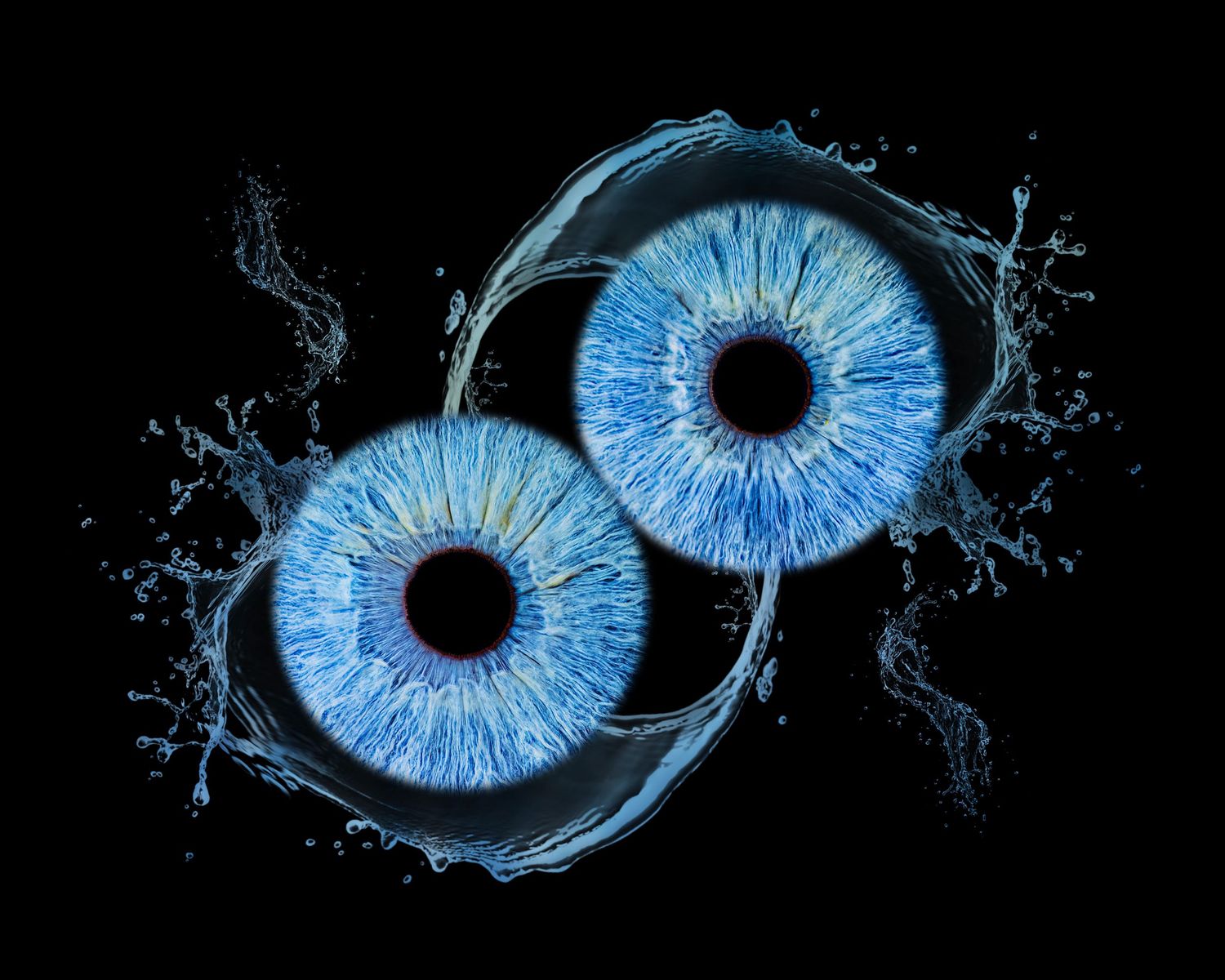 Two electric blue irises with water splash effects arranged symmetrically on black background.