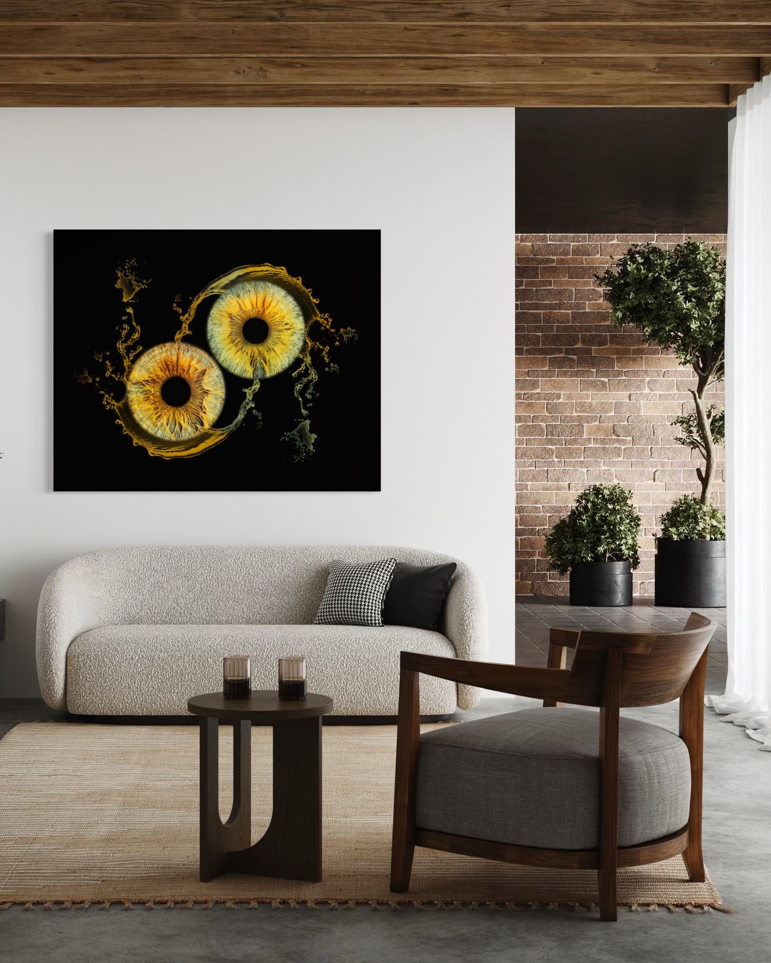 Modern living room with dark wall art featuring circular yellow sunflower designs against exposed brick wall.