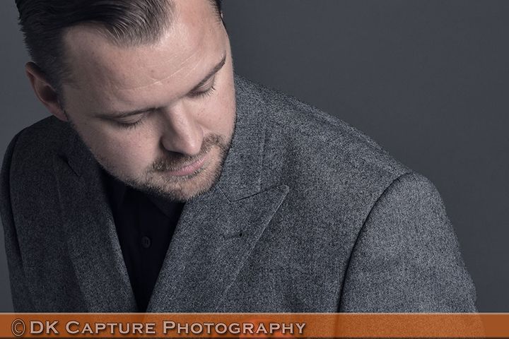 Professional studio headshot image of a person / group