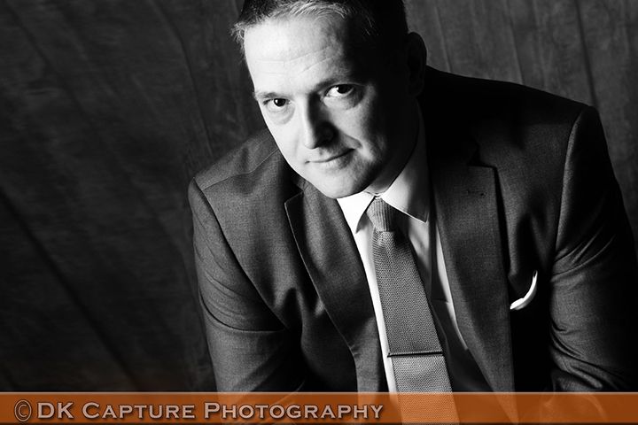 Professional studio headshot image of a person / group