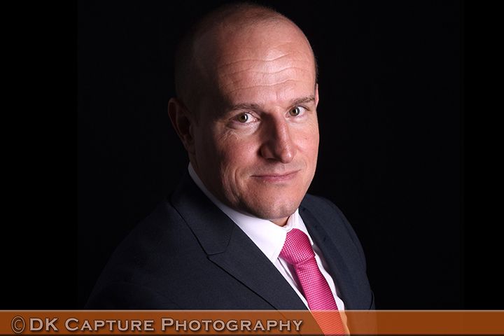 Professional studio headshot image of a person / group