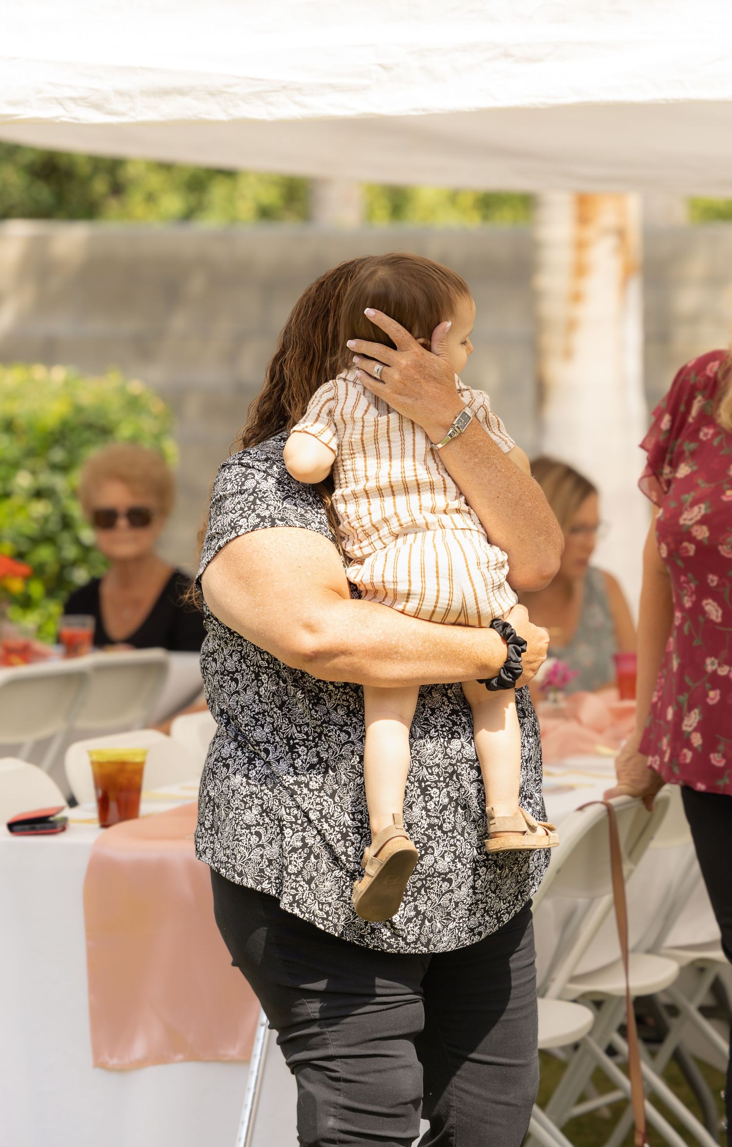 woman holding toddler