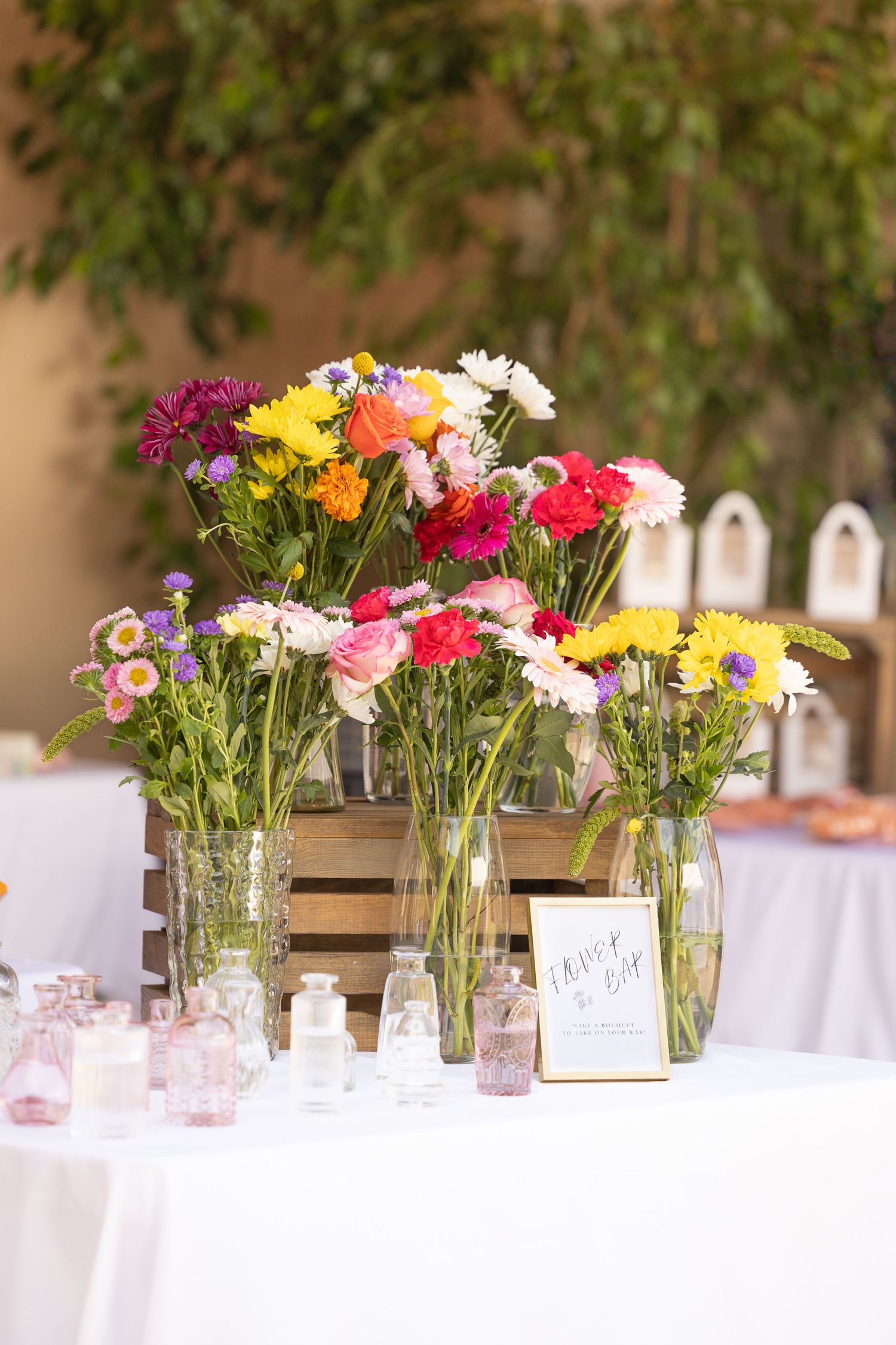 different colored flowers in vases