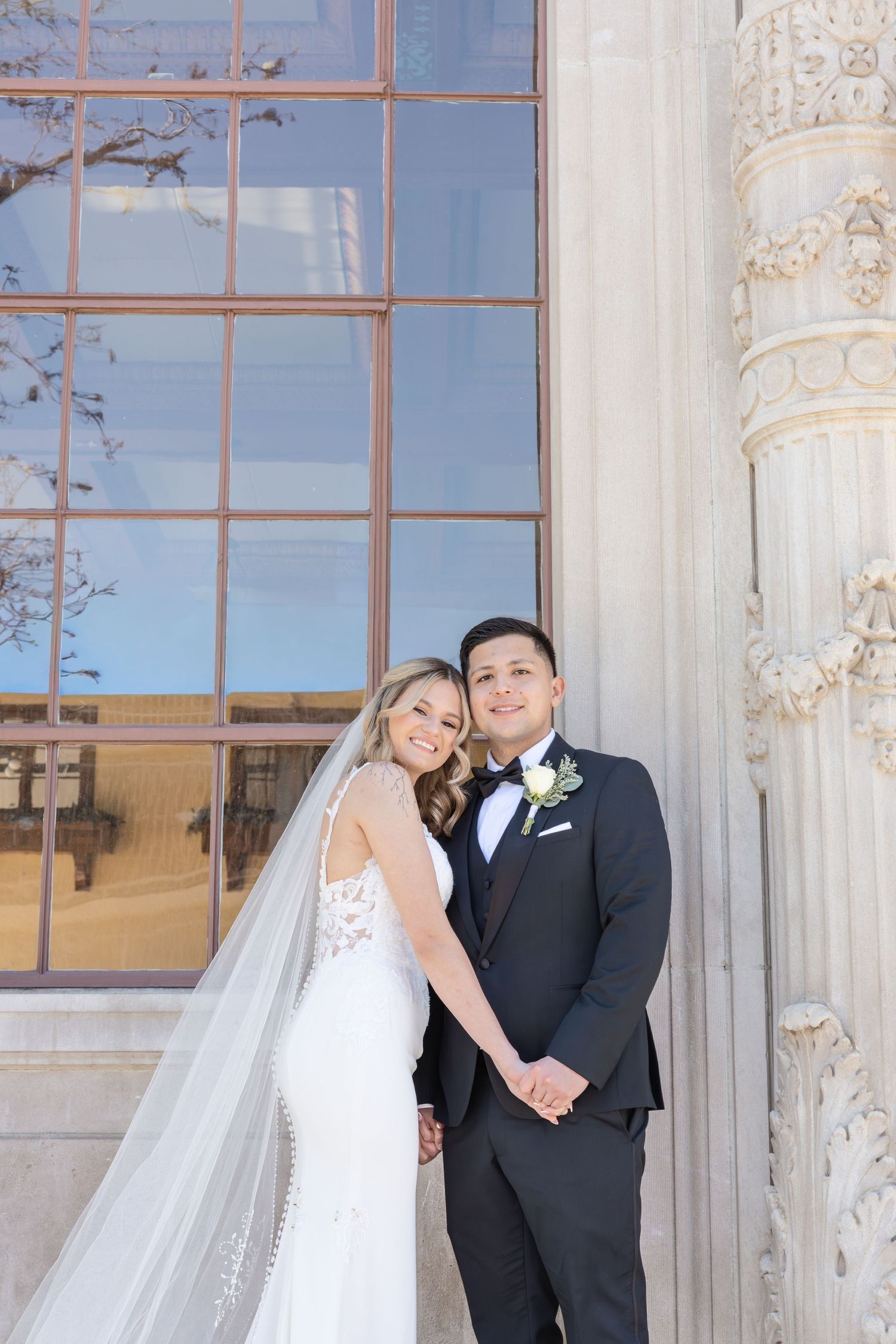 bride and groom holding hands