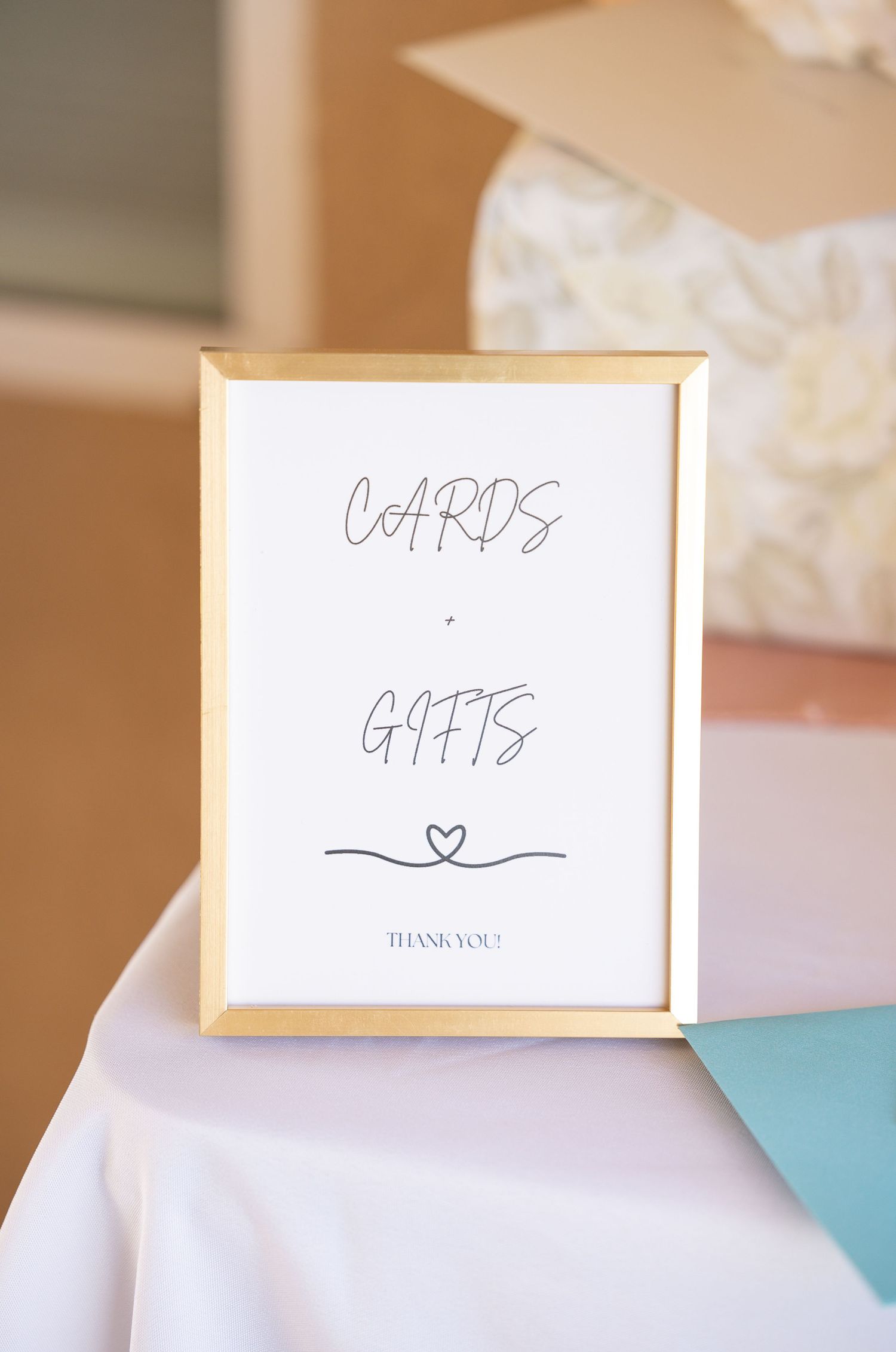 cards and gifts sign on table