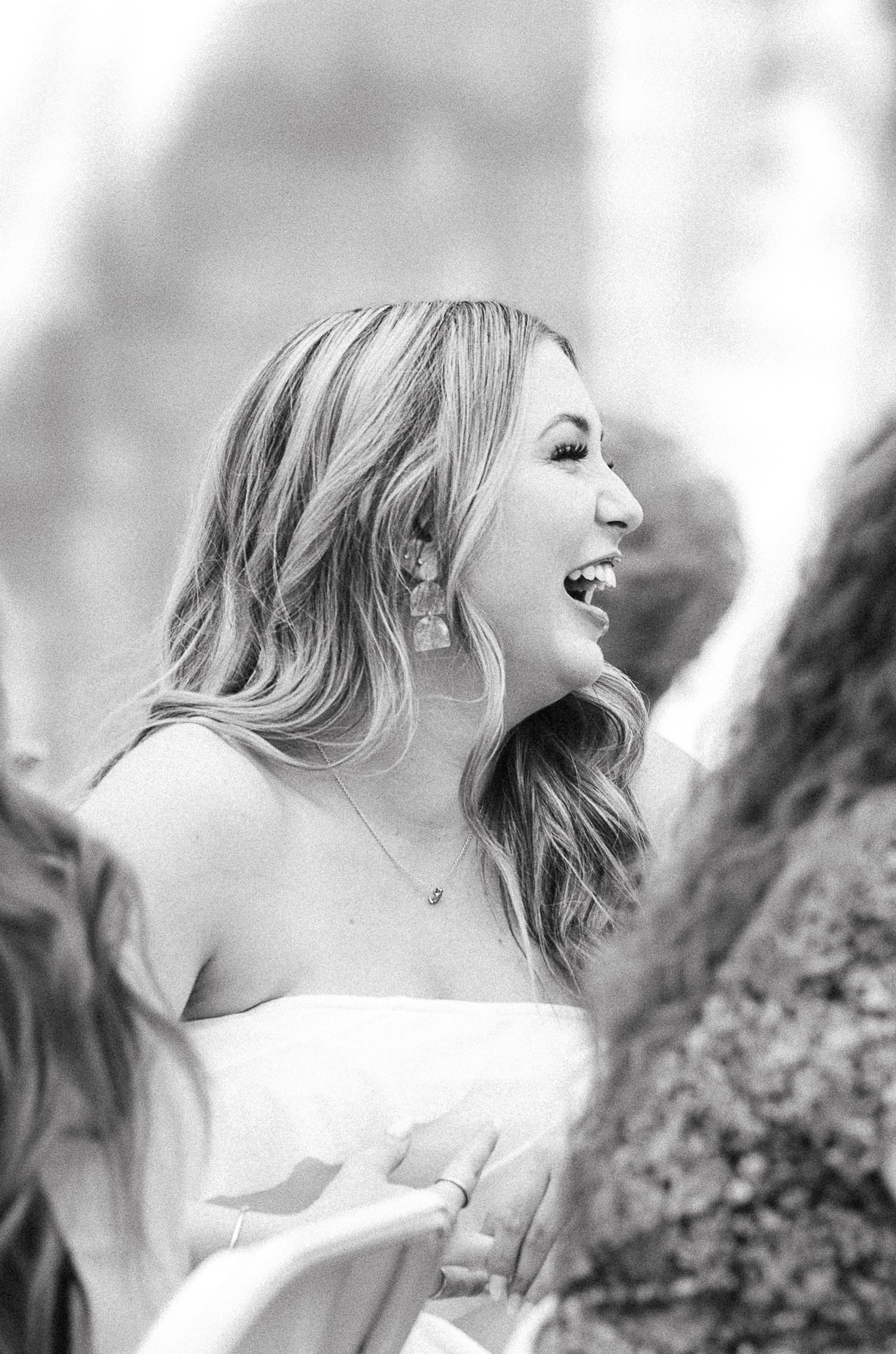 woman smiling in black and white