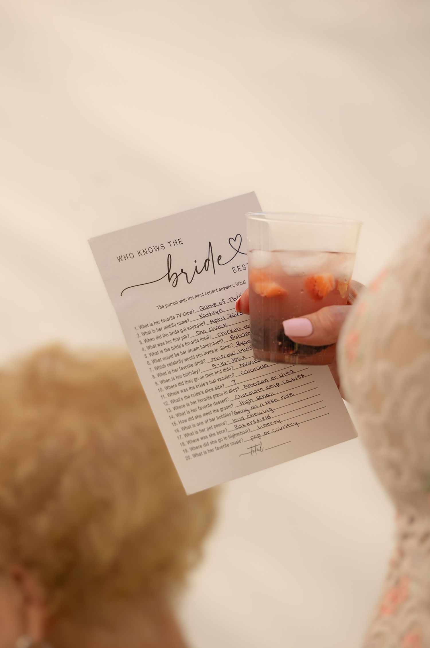 woman holding bridal shower game
