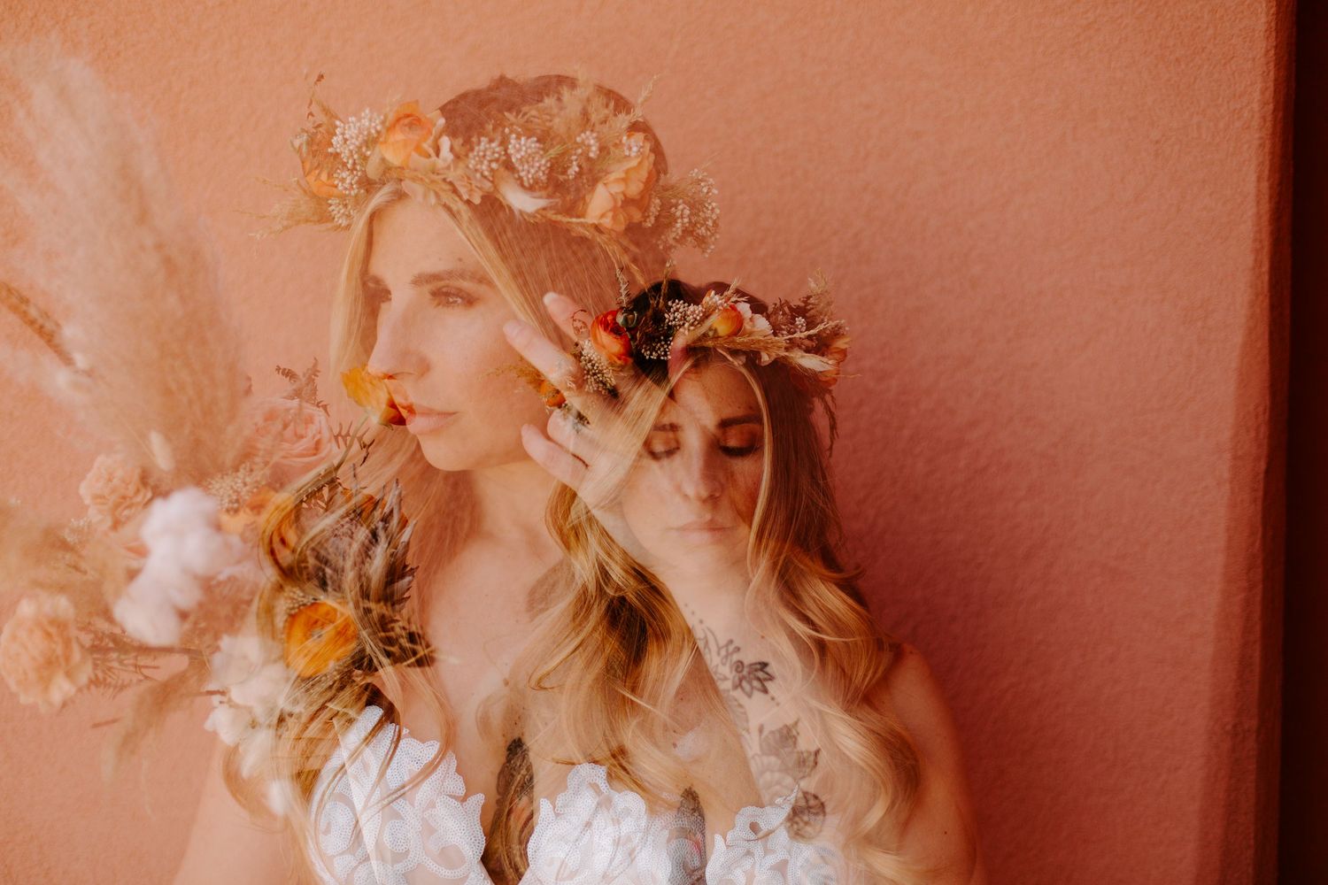 Artistic double exposure wedding portrait against coral colored wall with floral crown.