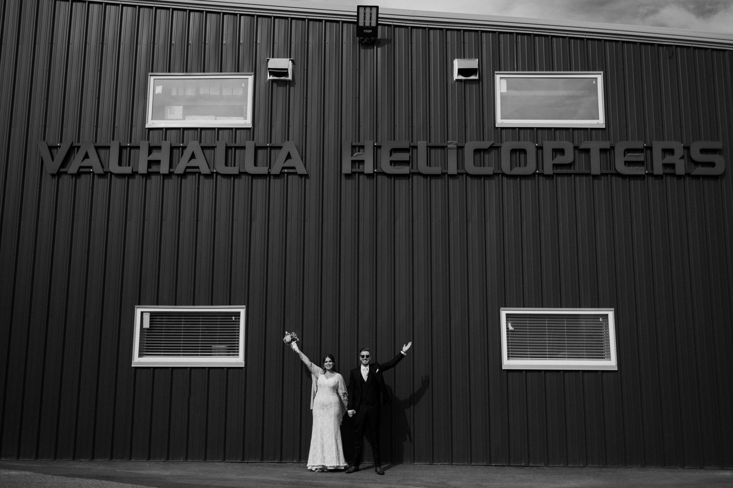 A series of black and white photos showing a helicopter tour business building exterior with signage and visitors.