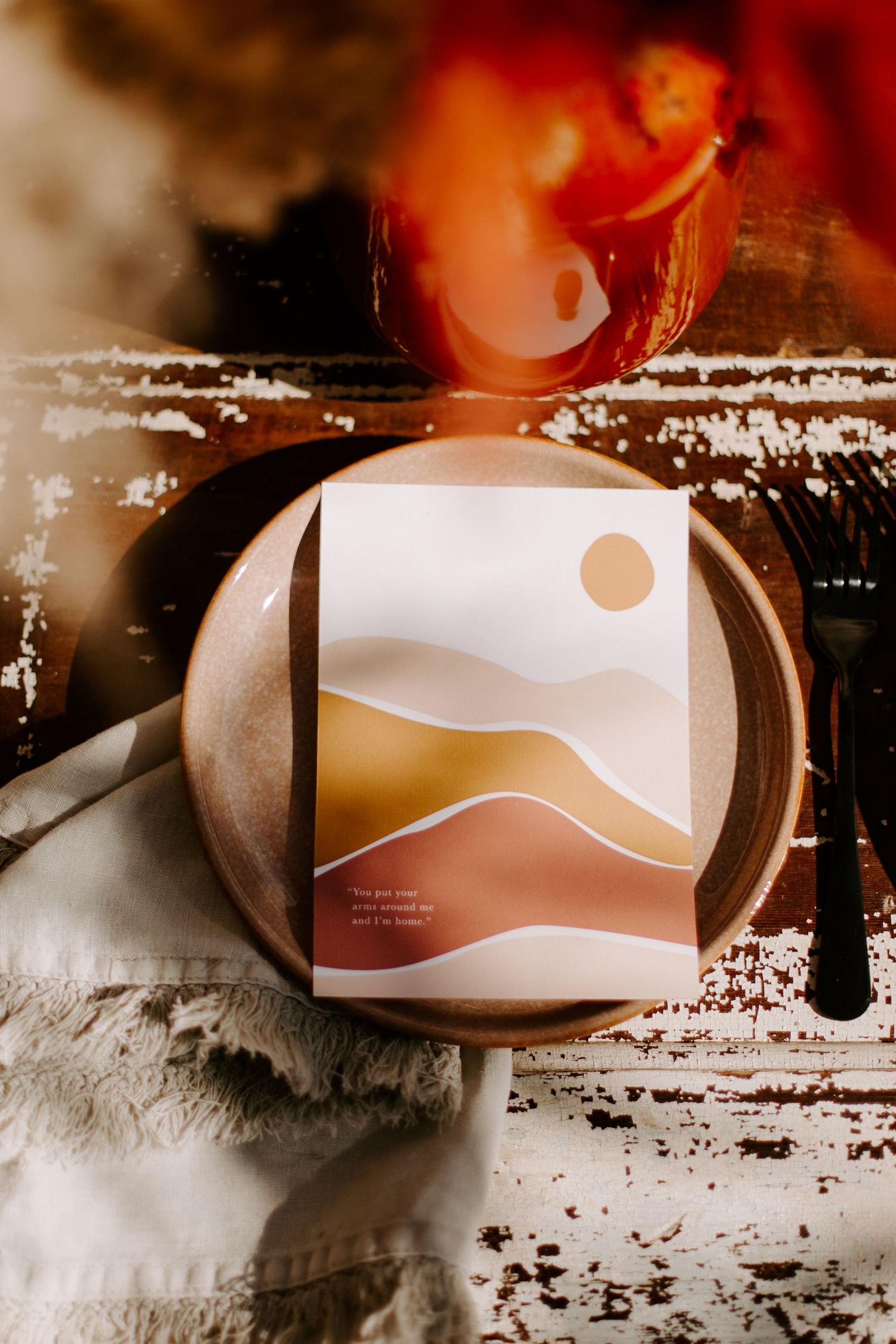 Modern desert landscape wedding menu card on elegant place setting.