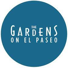 The Gardens on El Paseo logo on a teal circle background.