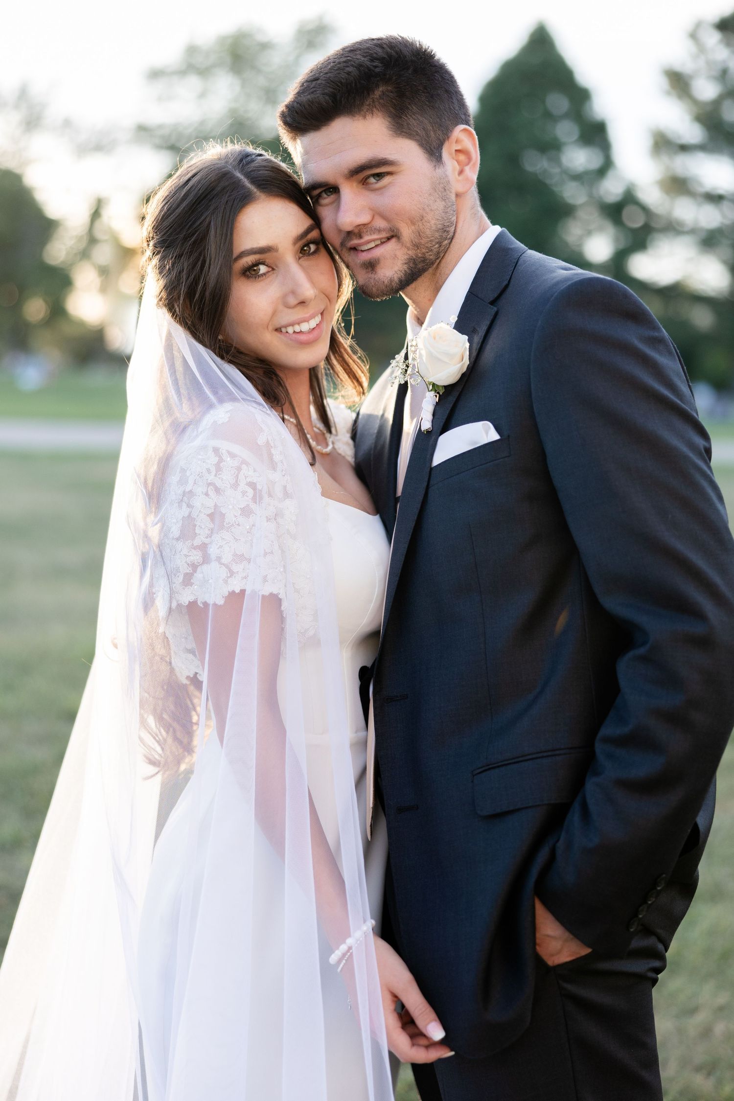 A romantic wedding photo series showing a couple in formal attire embracing outdoors during golden hour.