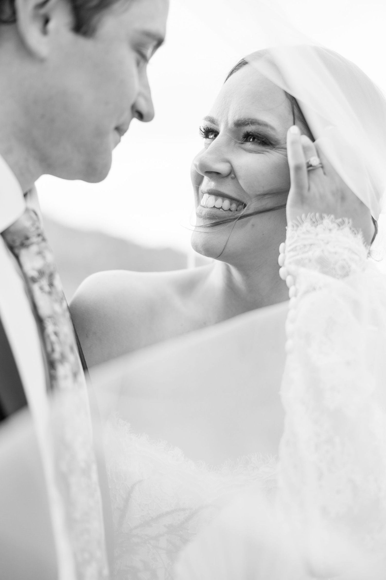 A series of black and white wedding photos showing intimate moments between a bride and groom.
