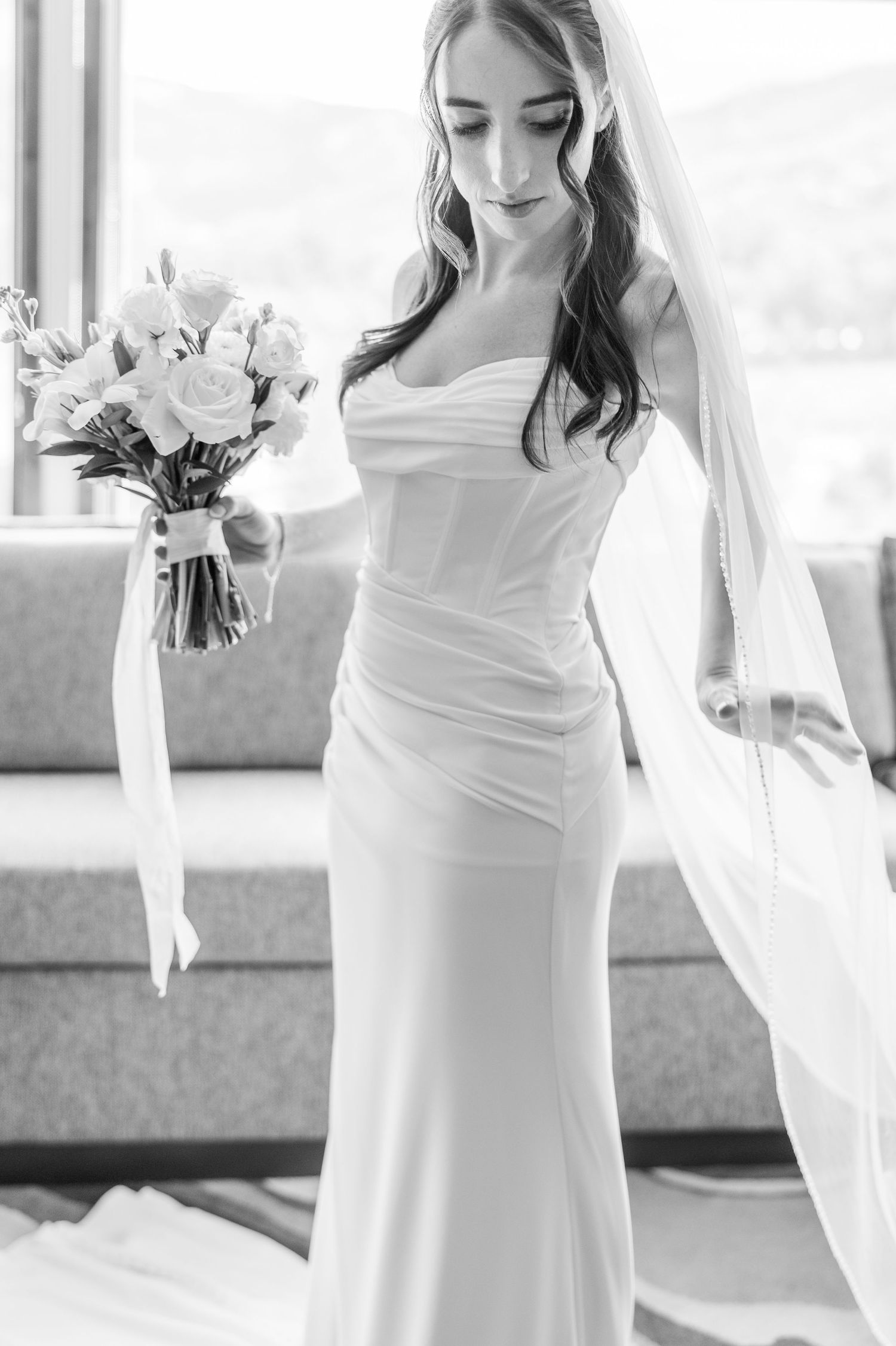 Elegant white wedding dress details shown in a series of black and white photos.