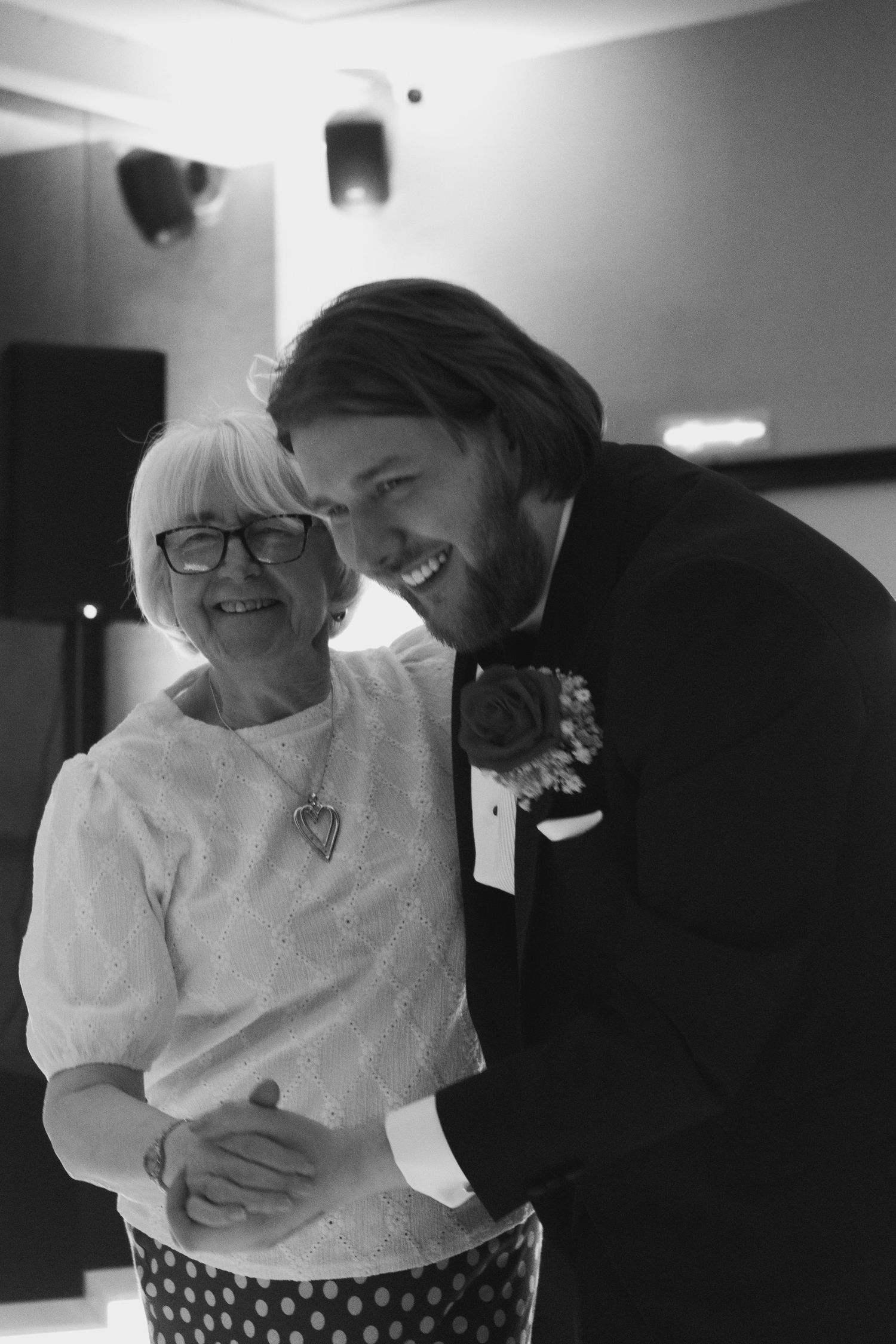 Groom sharing a heartfelt dance with a loved one during the wedding reception, captured by luxury wedding content creator Unveil by Hollie