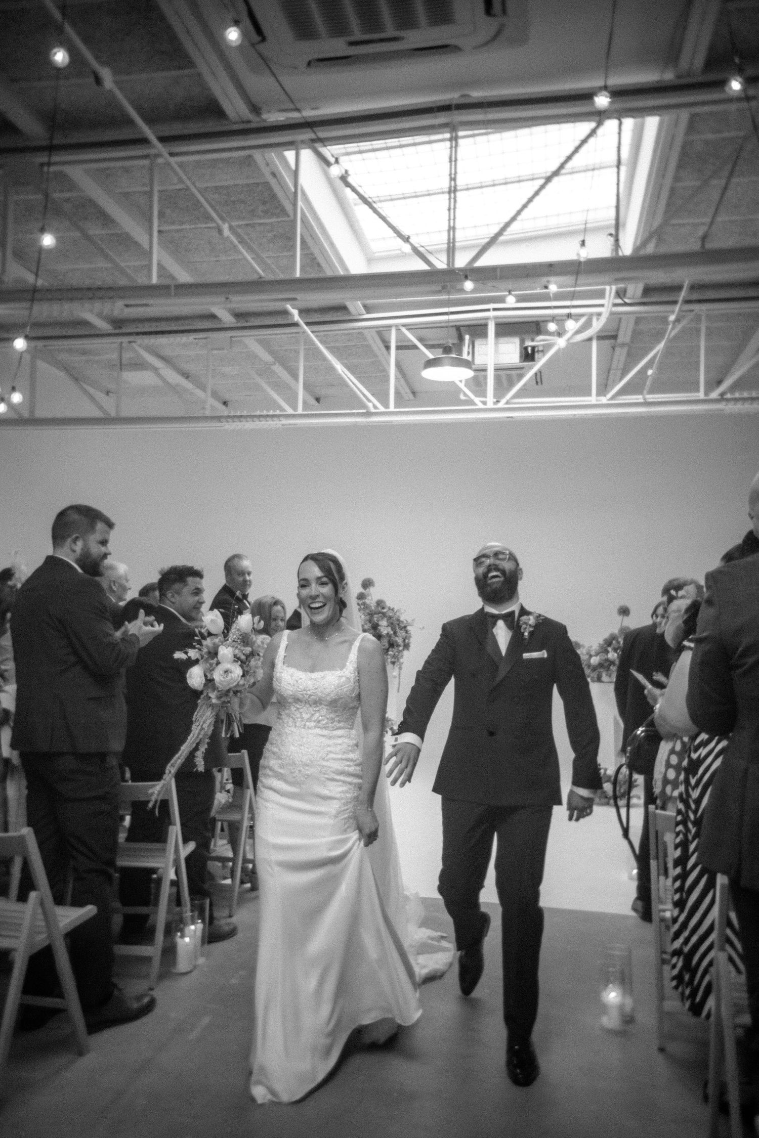 Bride and groom making their grand entrance into their wedding reception, captured by luxury wedding content creator Unveil by Hollie