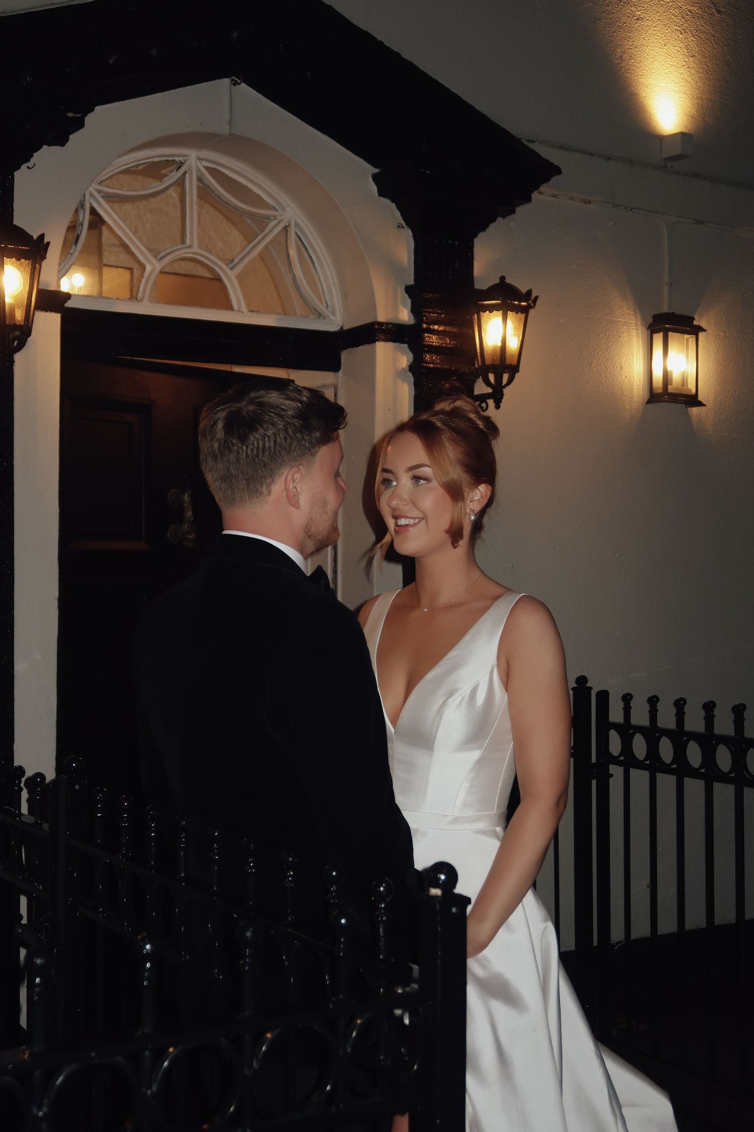 Bride and groom sharing an intimate evening moment outside their wedding venue, captured by luxury wedding content creator Unveil by Hollie