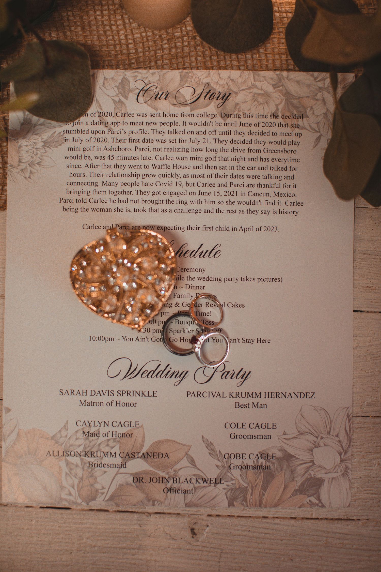 Wedding invitation with gold rings and a decorative ring box