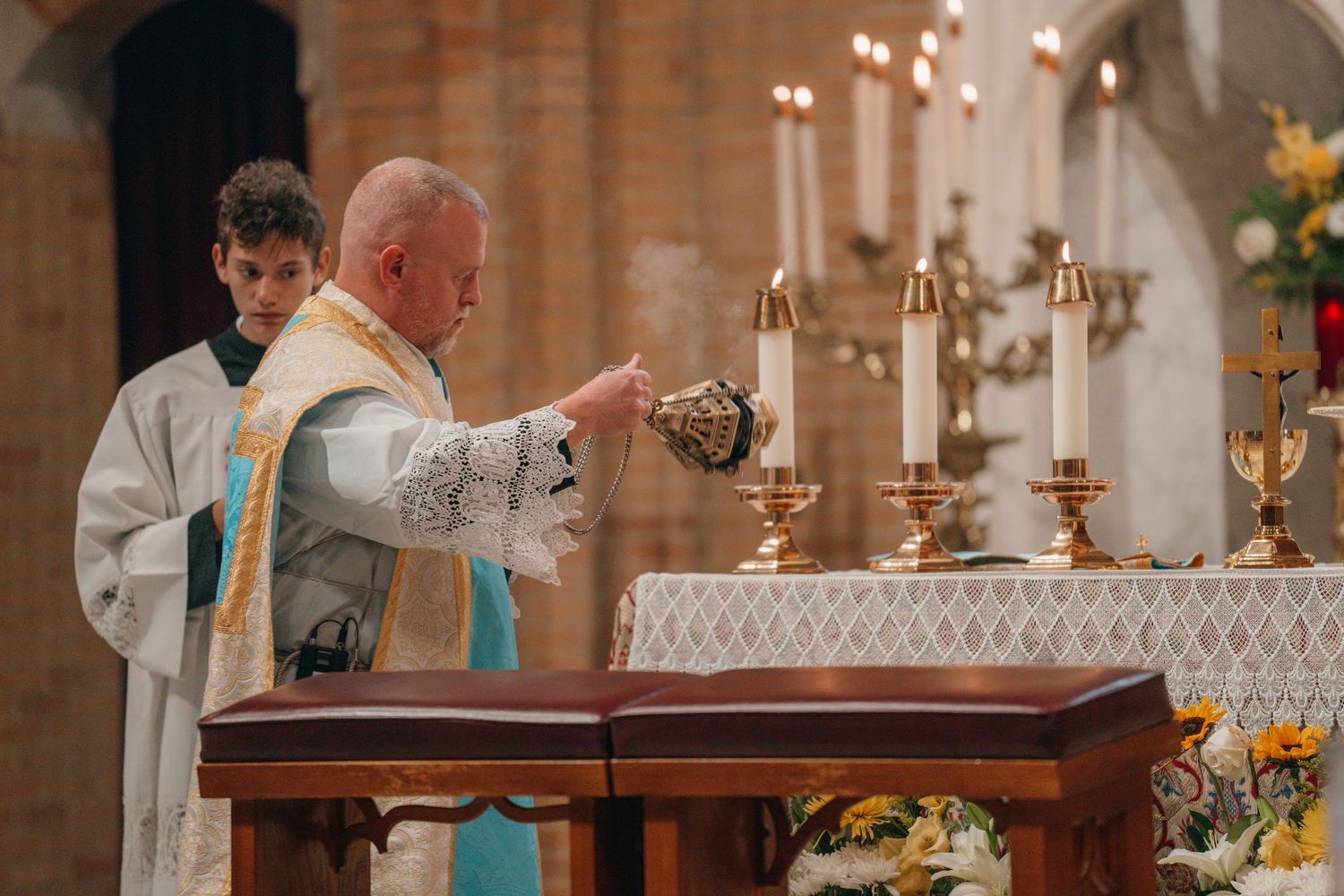Priest elevating the host during the Eucharist at a Nuptial Mass