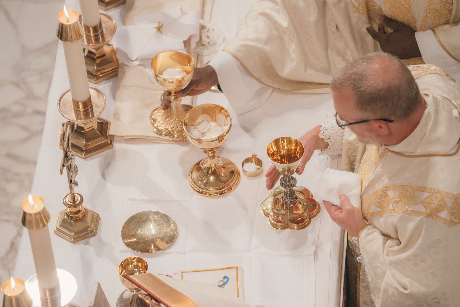 Overhead view of the priest consecrating the Eucharist at a Nuptial Mass